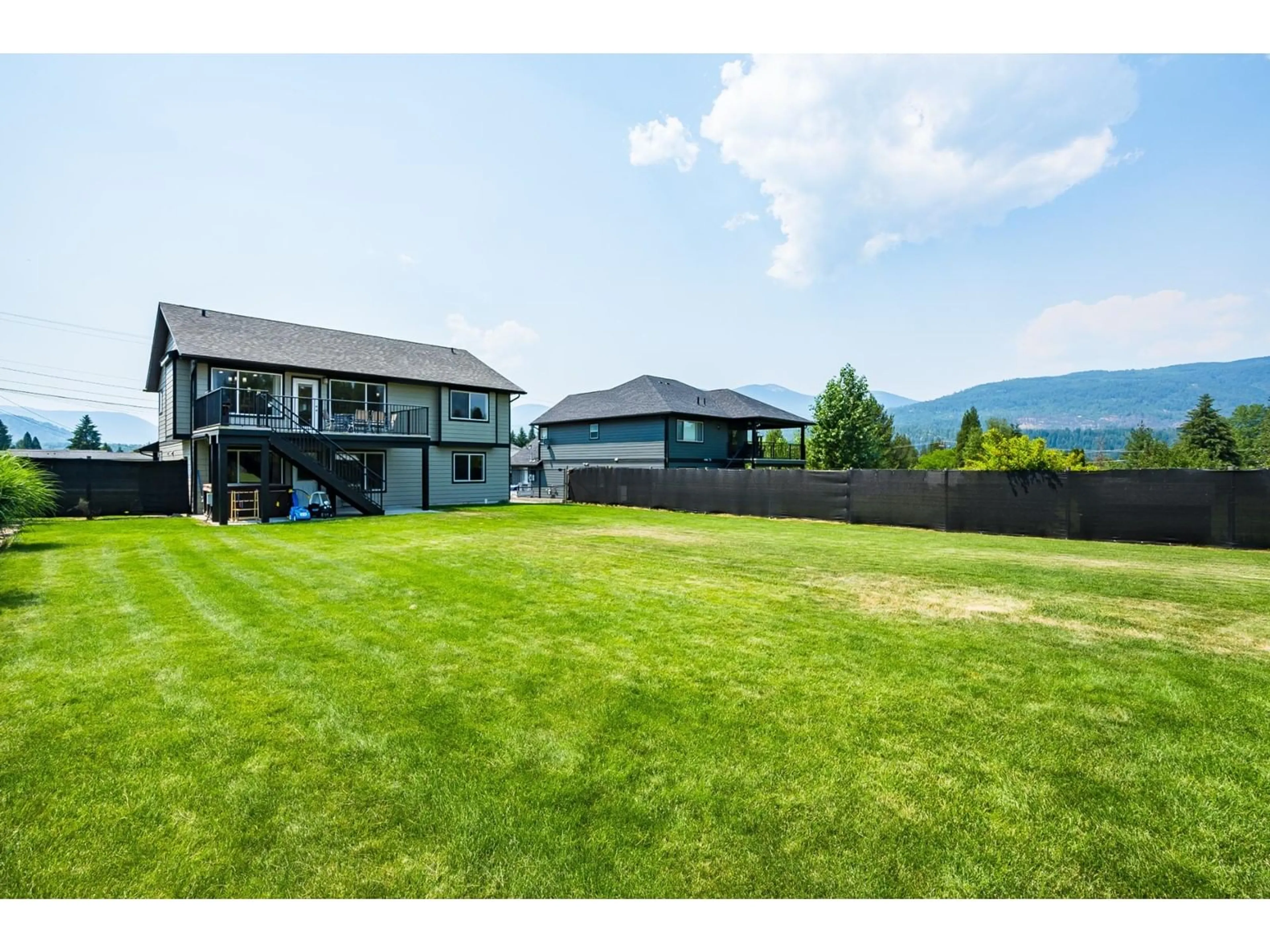 Frontside or backside of a home, the fenced backyard for 934 HILLVIEW Road, Ootischenia British Columbia V1N4K7