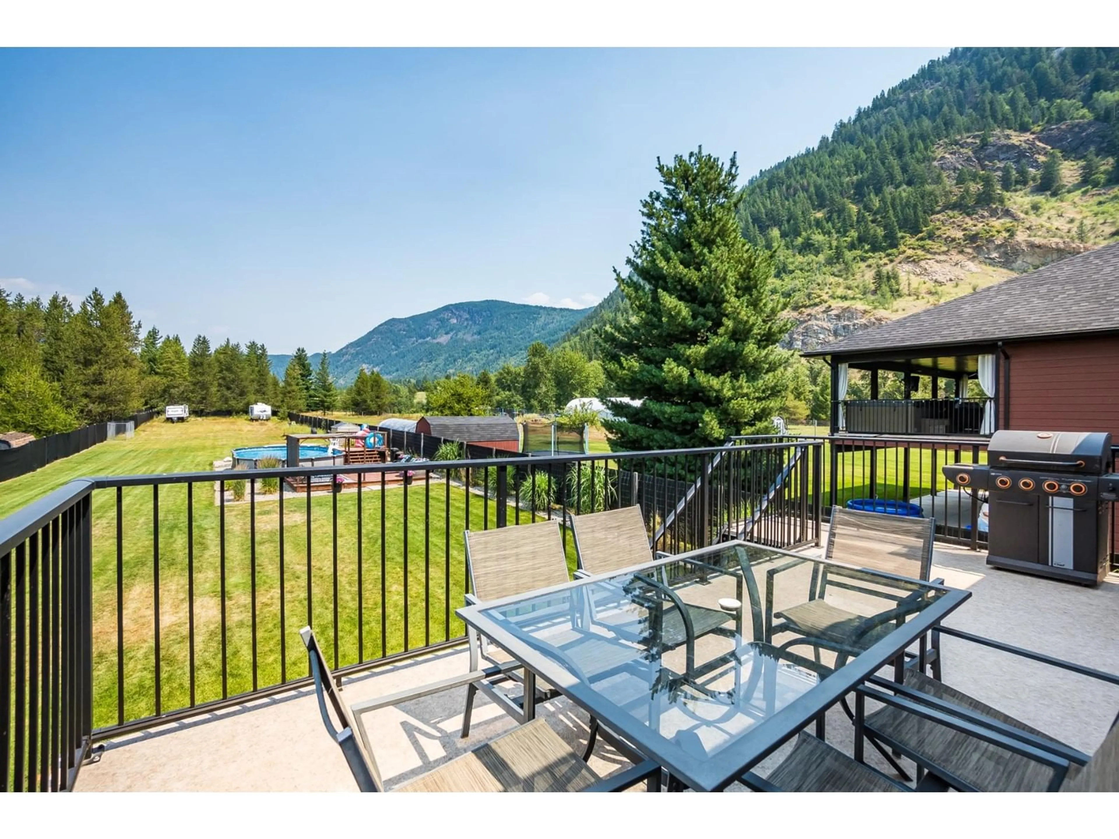 Patio, the fenced backyard for 934 HILLVIEW Road, Ootischenia British Columbia V1N4K7