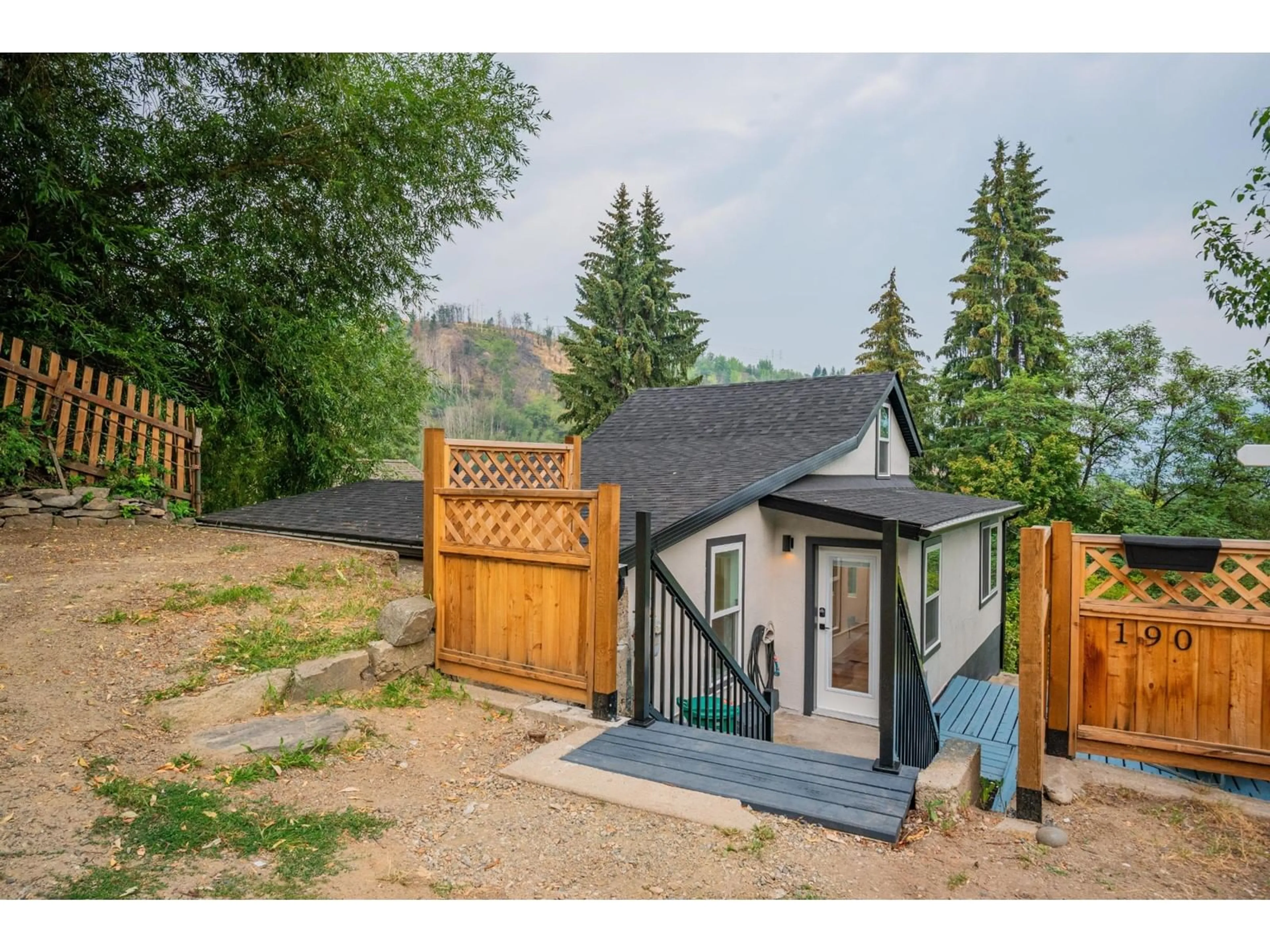 Frontside or backside of a home, the fenced backyard for 190 COLEMAN Street, Trail British Columbia V1R3L9