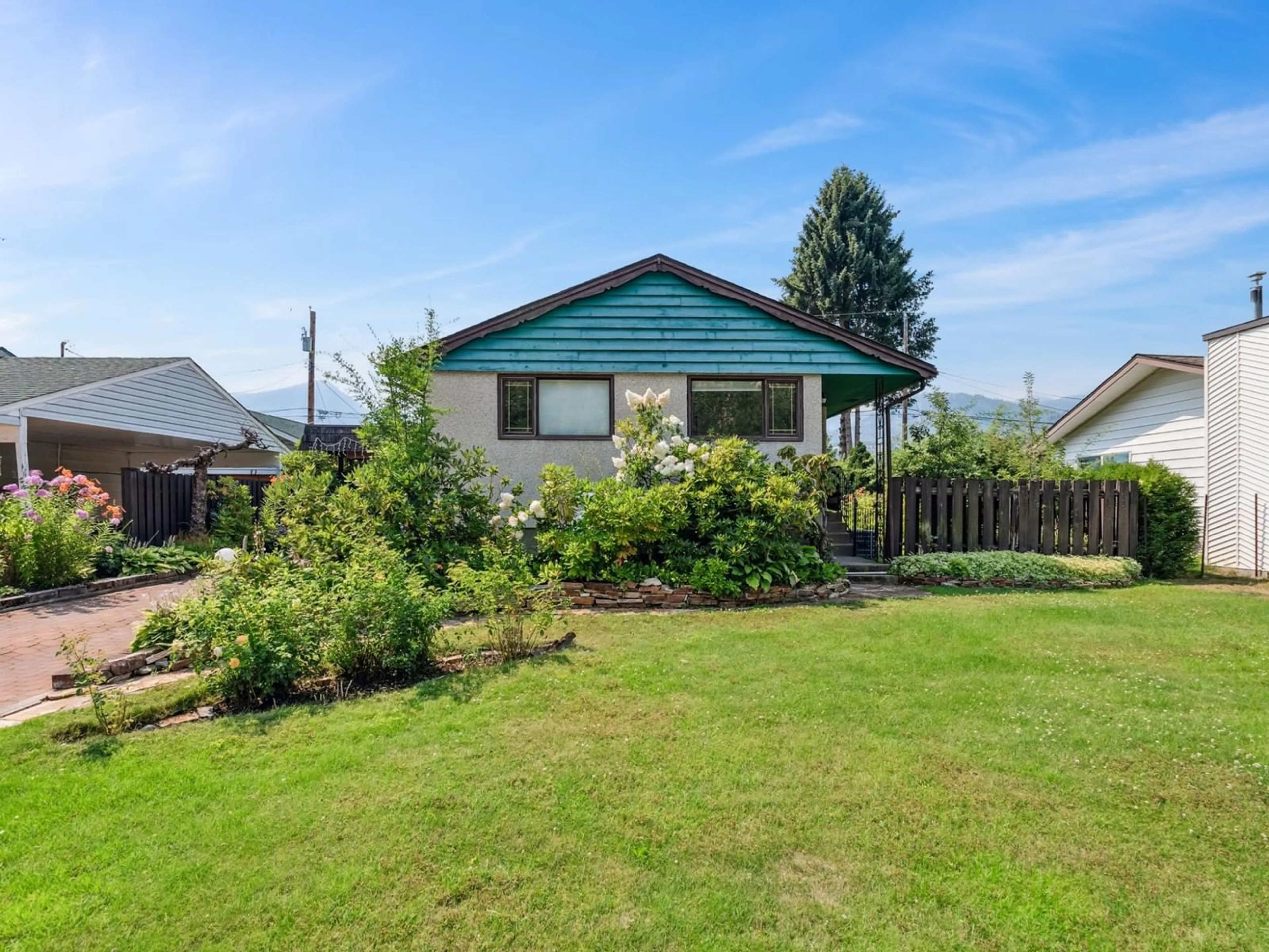 Frontside or backside of a home, the fenced backyard for 1150 MARIANNA Crescent, Trail British Columbia V1R1E1