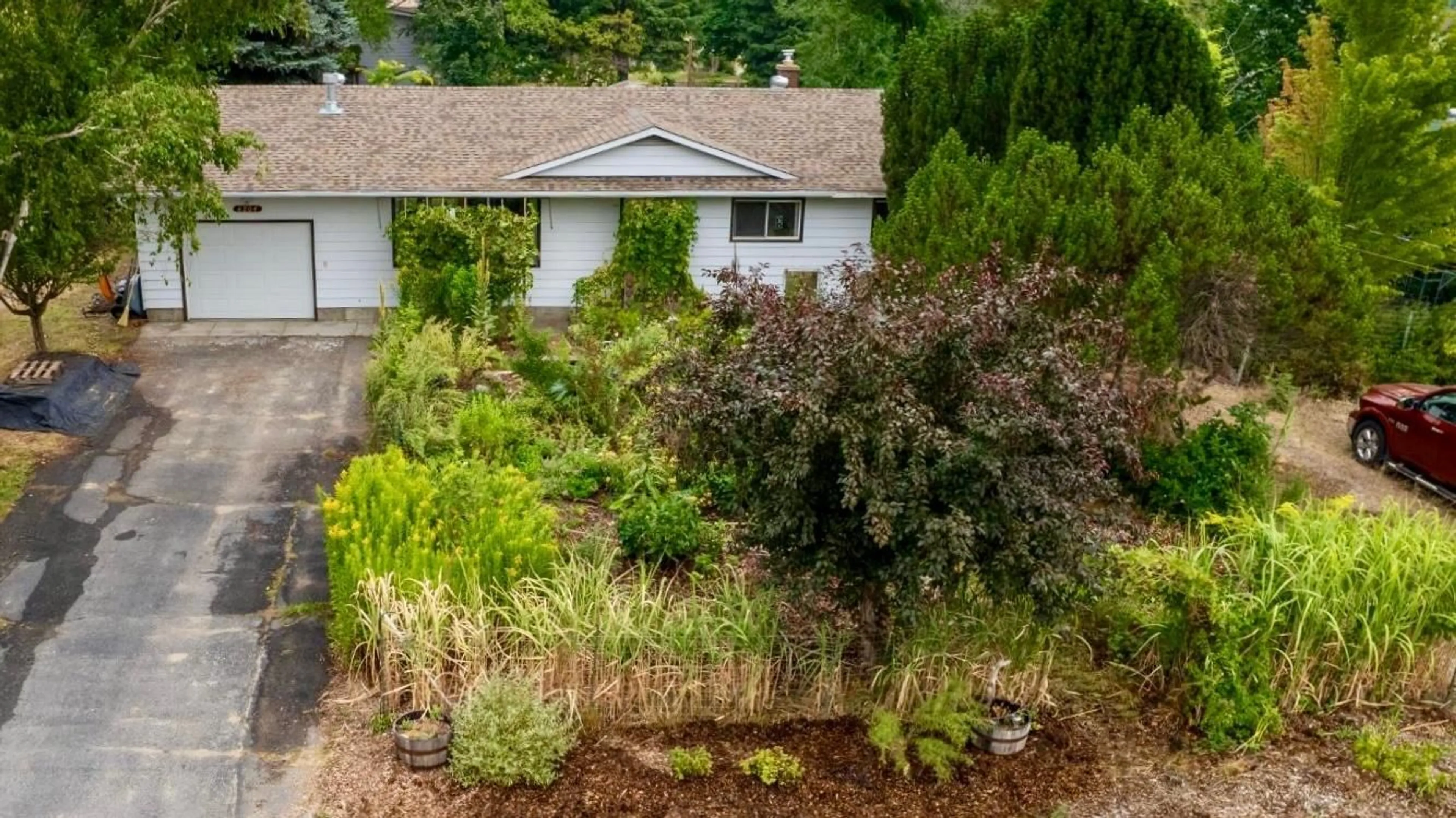 Frontside or backside of a home, the fenced backyard for 6204 YORK Road, Grand Forks British Columbia V0H1H2