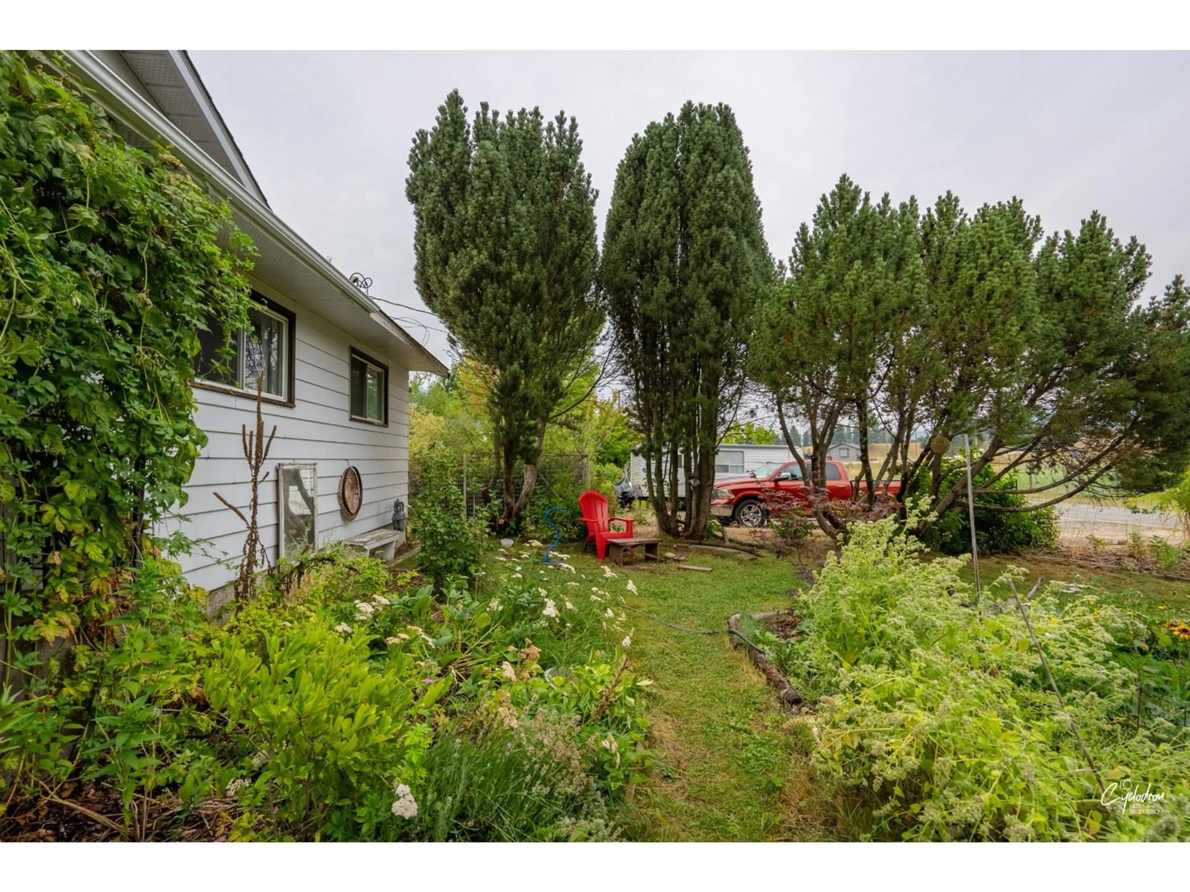 Frontside or backside of a home, the fenced backyard for 6204 YORK Road, Grand Forks British Columbia V0H1H2