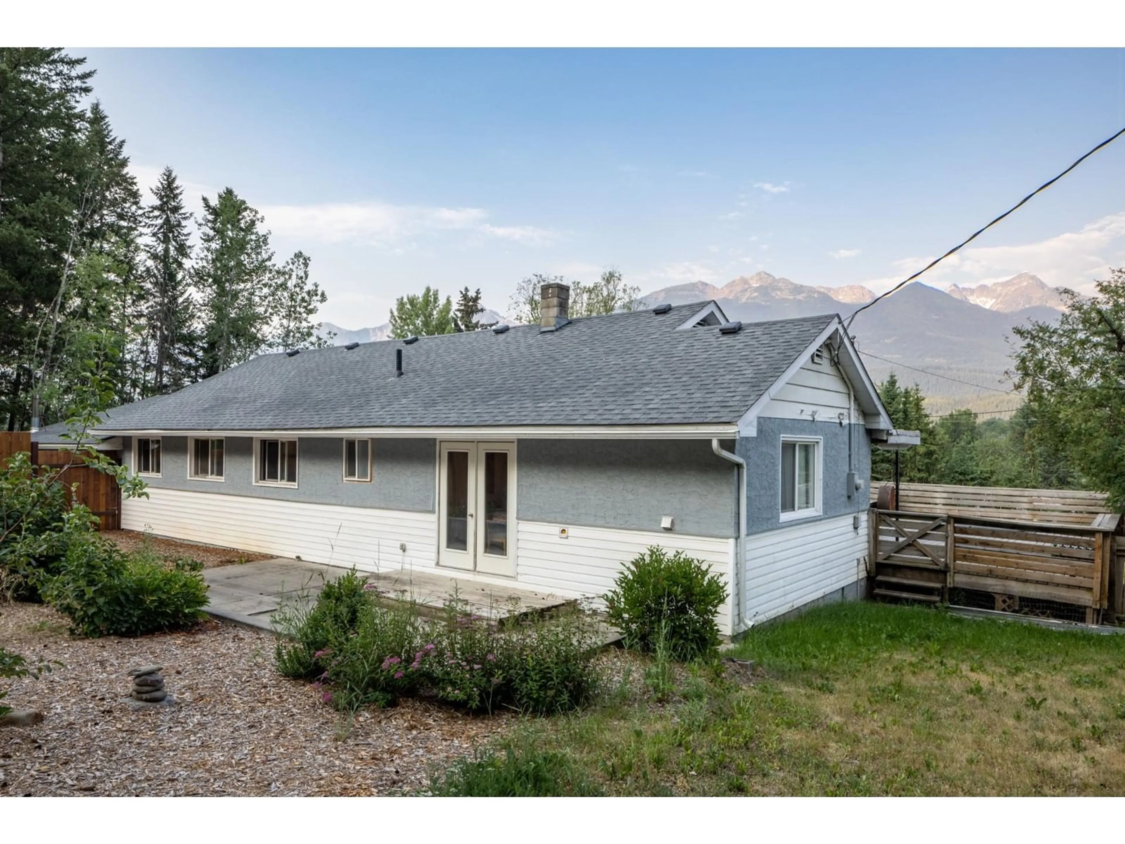 Frontside or backside of a home, the fenced backyard for 773 NICHOLSON Road, Golden British Columbia V0A1H2