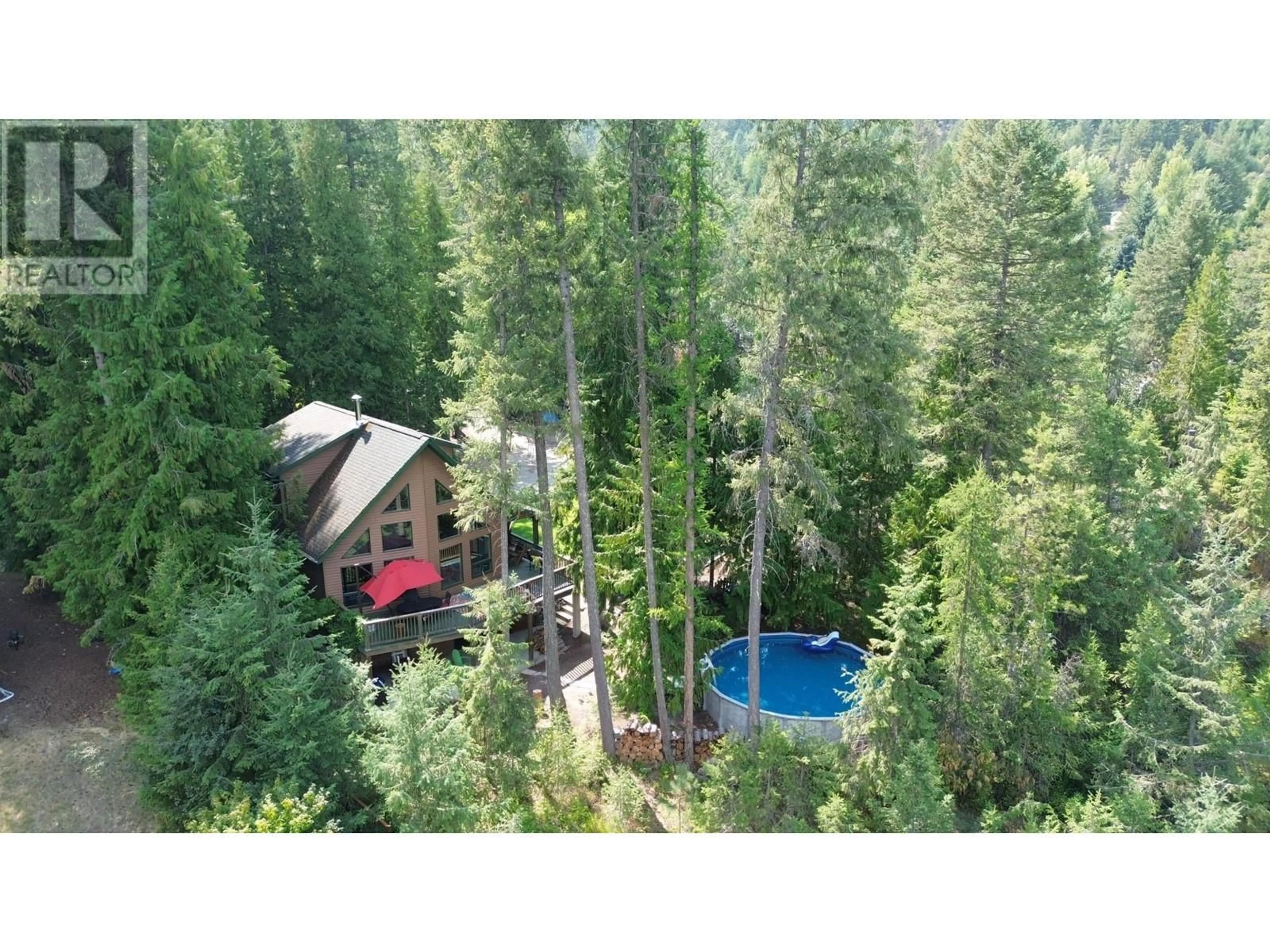 A pic from outside/outdoor area/front of a property/back of a property/a pic from drone, forest/trees view for 1360 FRISK ROAD, Christina Lake British Columbia V0H1E0