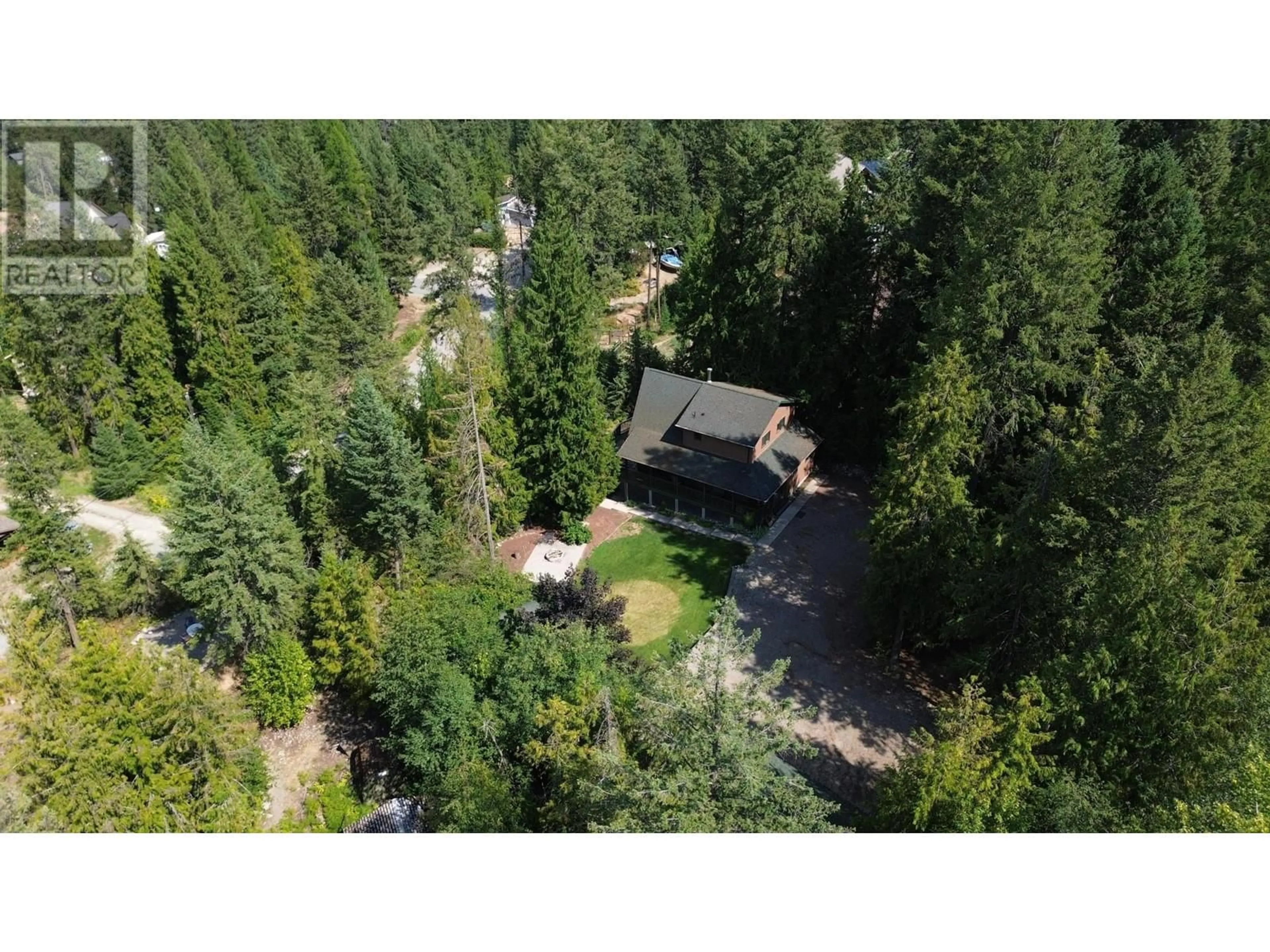 A pic from outside/outdoor area/front of a property/back of a property/a pic from drone, forest/trees view for 1360 FRISK ROAD, Christina Lake British Columbia V0H1E0