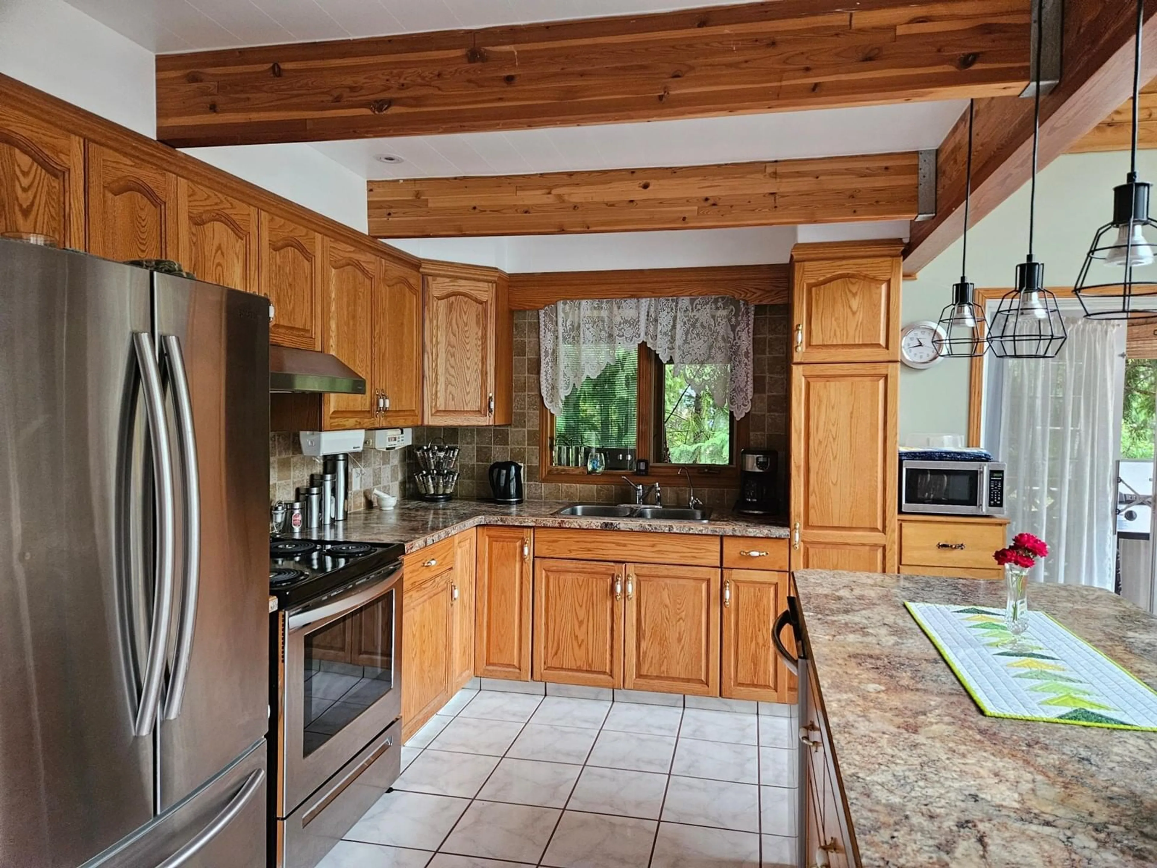 Kitchen, wood floors, cottage for 432 BAYLES Road, Nakusp British Columbia V0G1R1