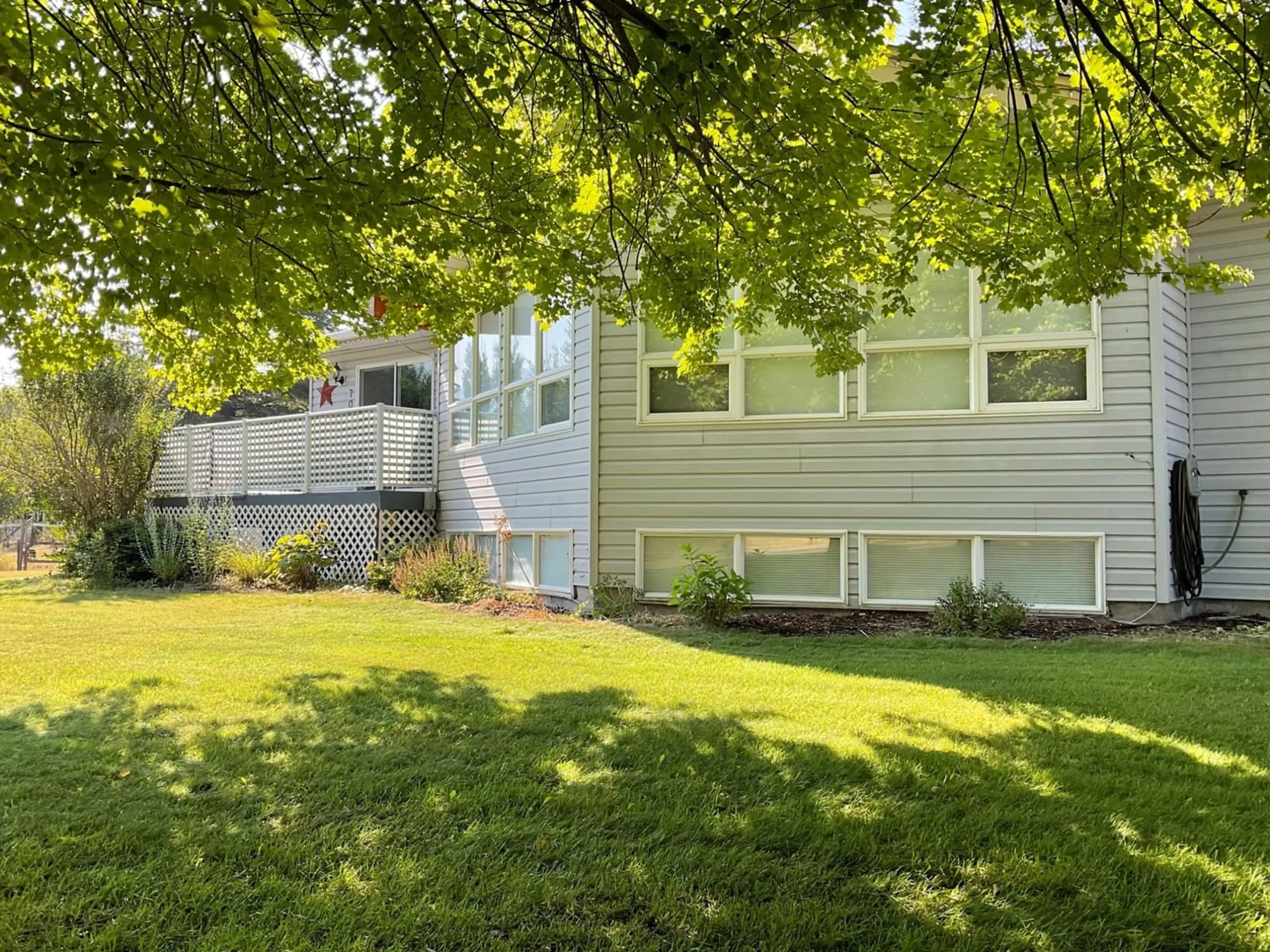 Frontside or backside of a home, the fenced backyard for 706 CENTRAL Avenue, Midway British Columbia V0H1M0