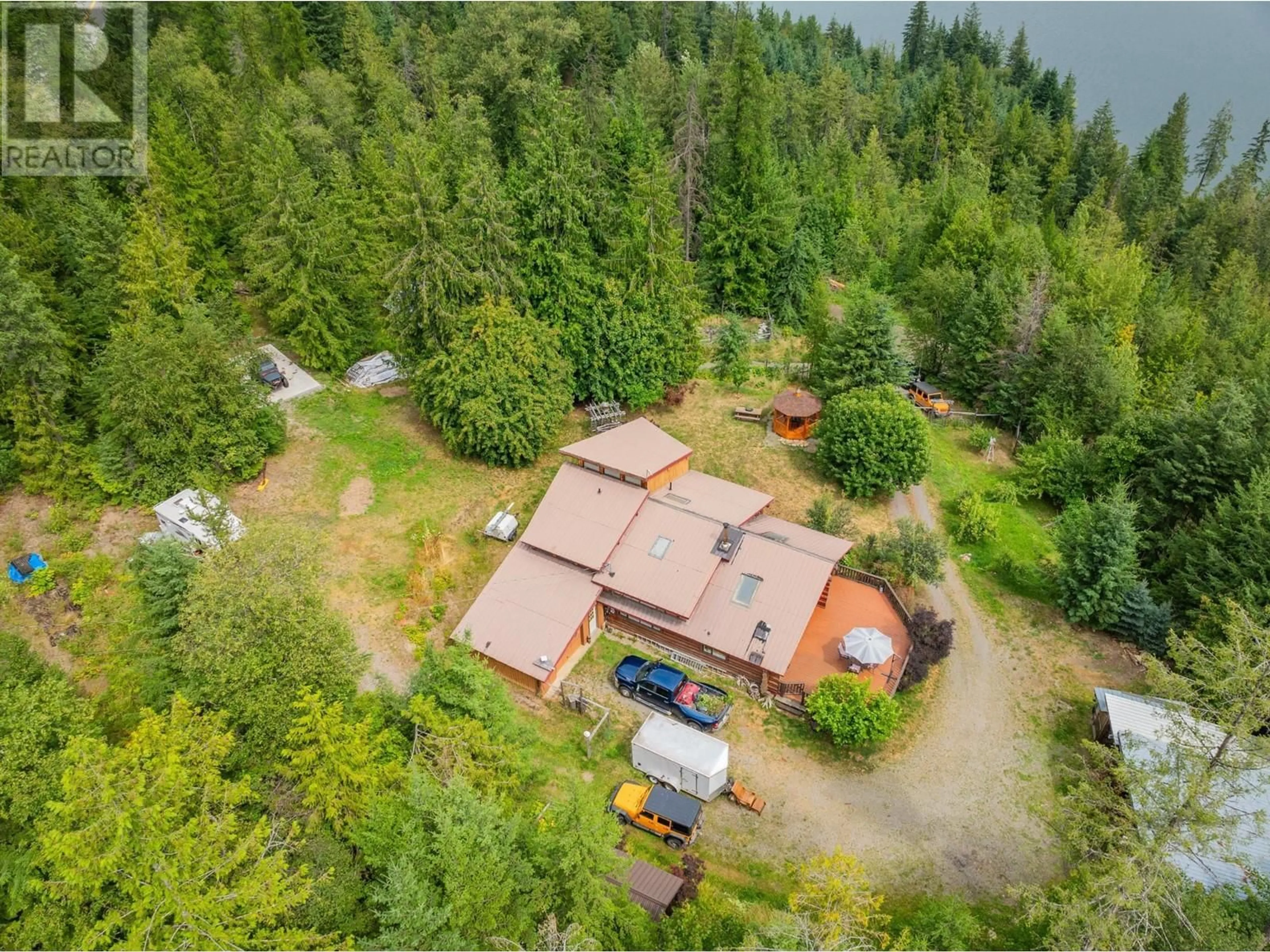 A pic from outside/outdoor area/front of a property/back of a property/a pic from drone, forest/trees view for 9413 SHUTTY BENCH ROAD, Kaslo British Columbia V0G1M0