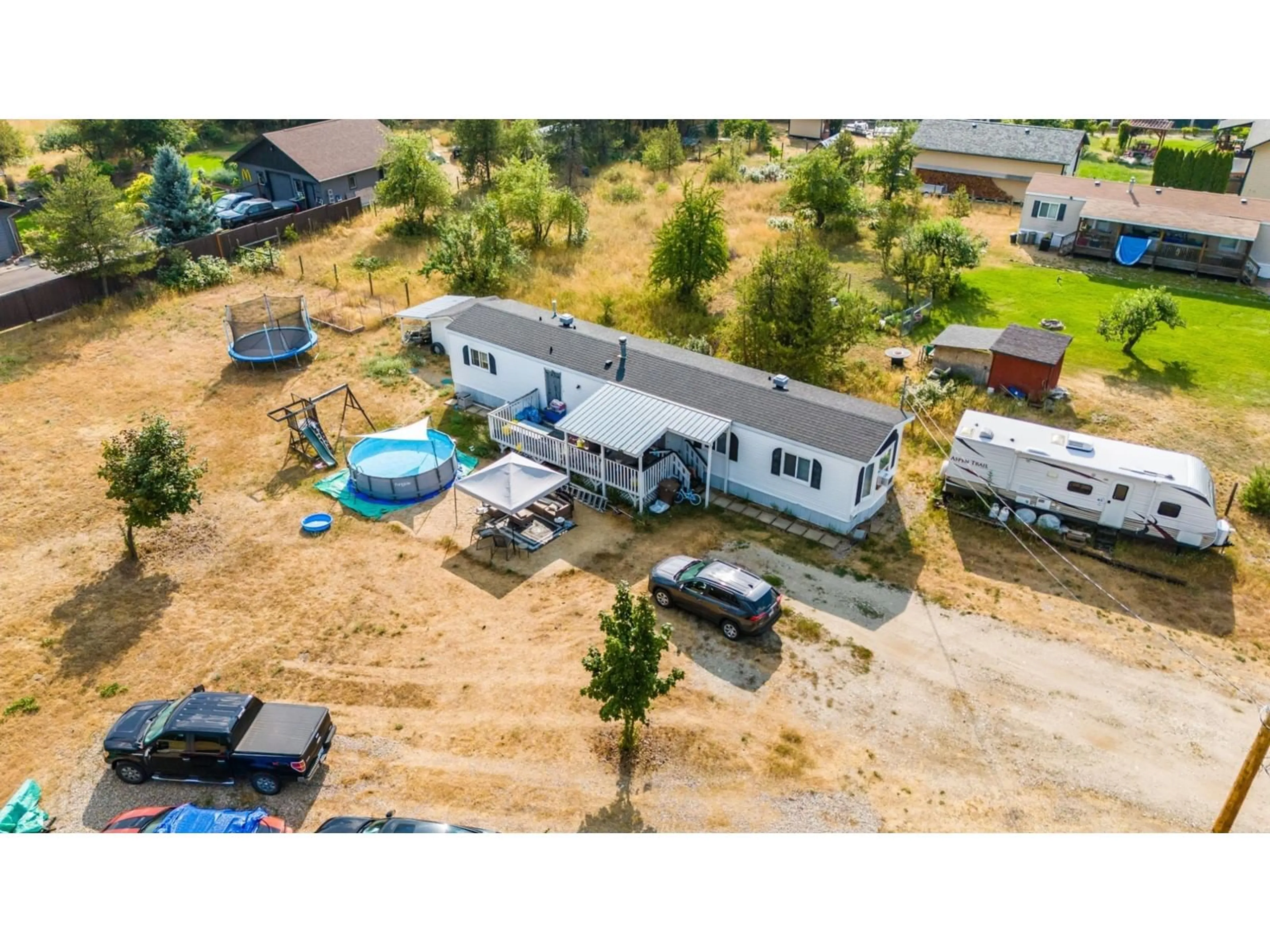 Frontside or backside of a home, the fenced backyard for 996 WATERLOO Road, Ootischenia British Columbia V1N4M3