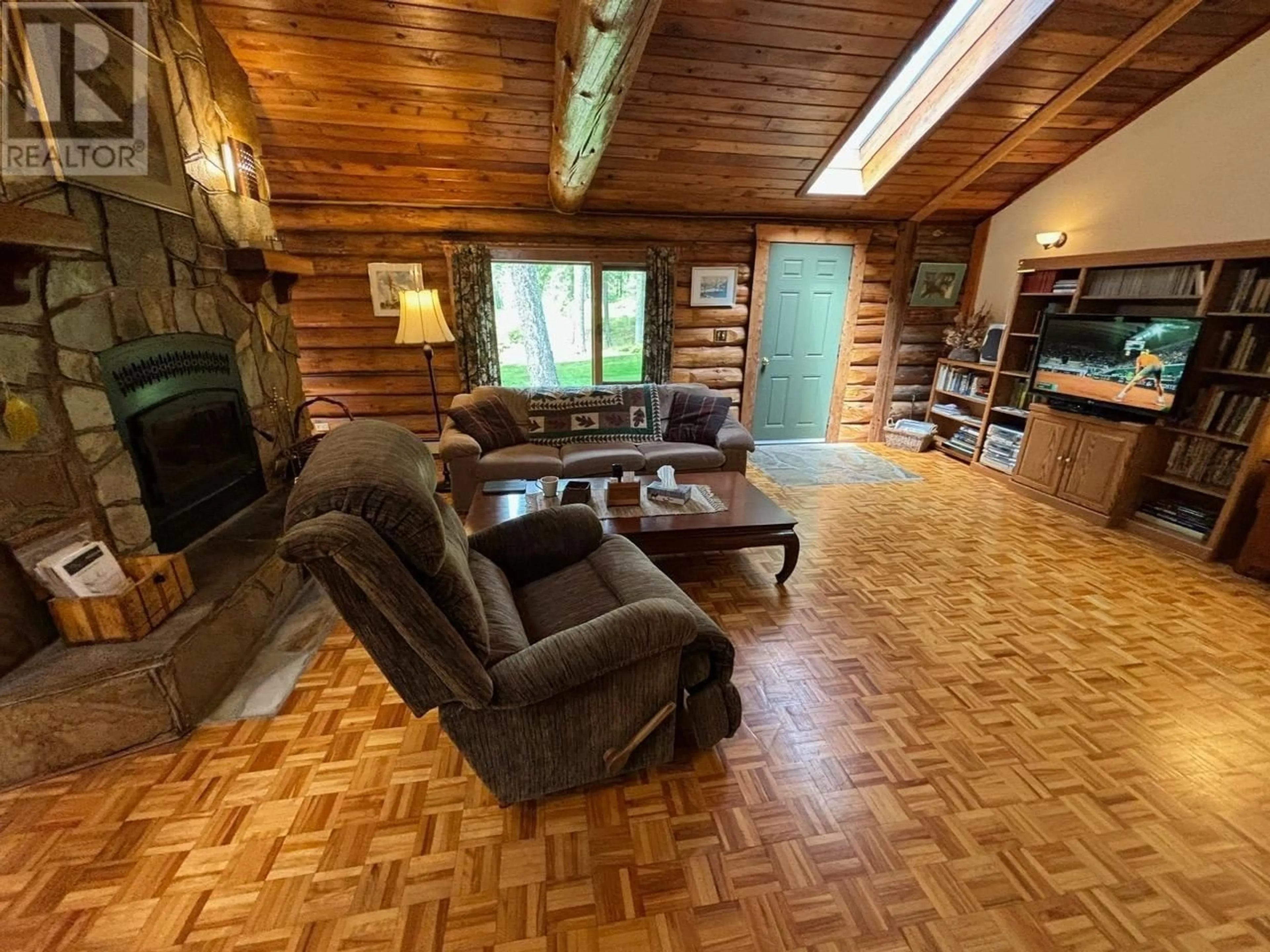 Living room with furniture, wood/laminate floor for 1980 SNOWBALL CREEK ROAD, Grand Forks British Columbia V0H1H1