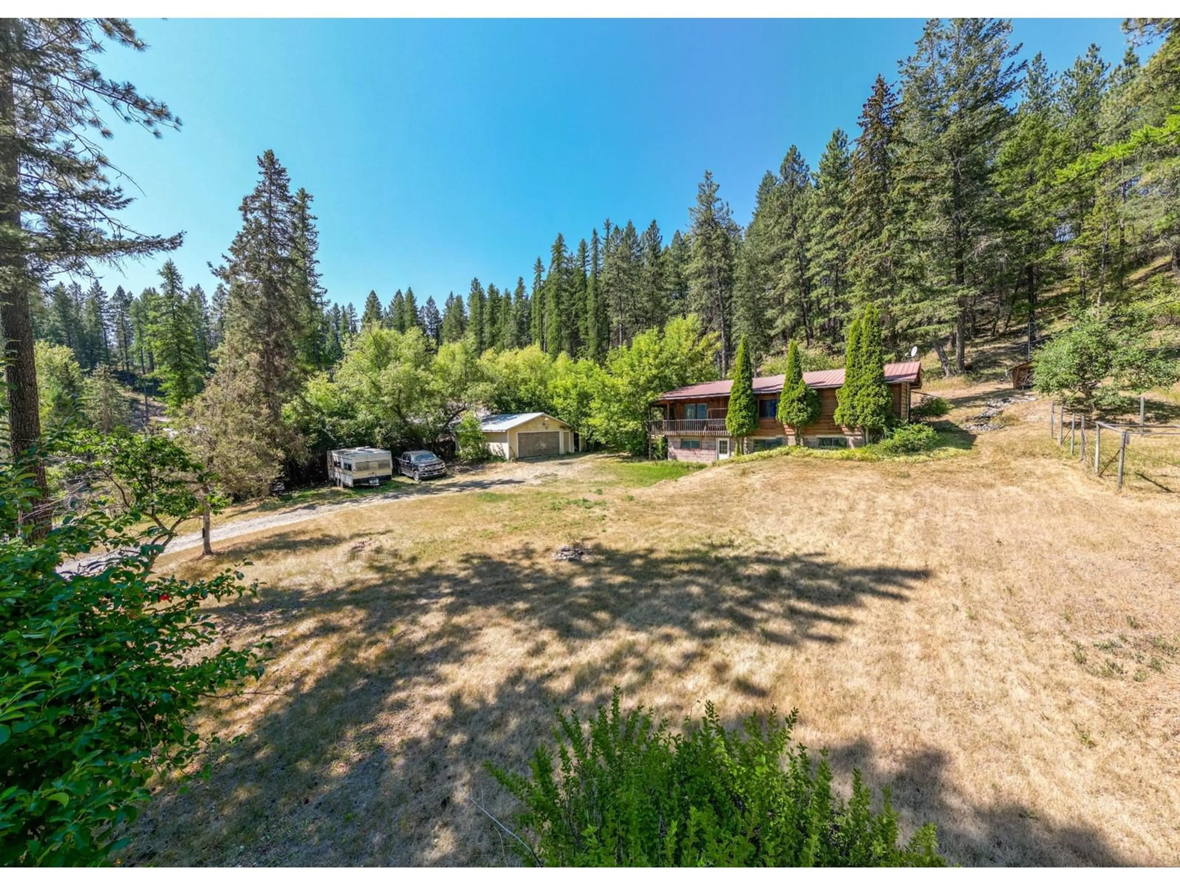 A pic from exterior of the house or condo, the fenced backyard for 7837 JAFFRAY BAYNES LAKE Road, Jaffray British Columbia V0B1T0