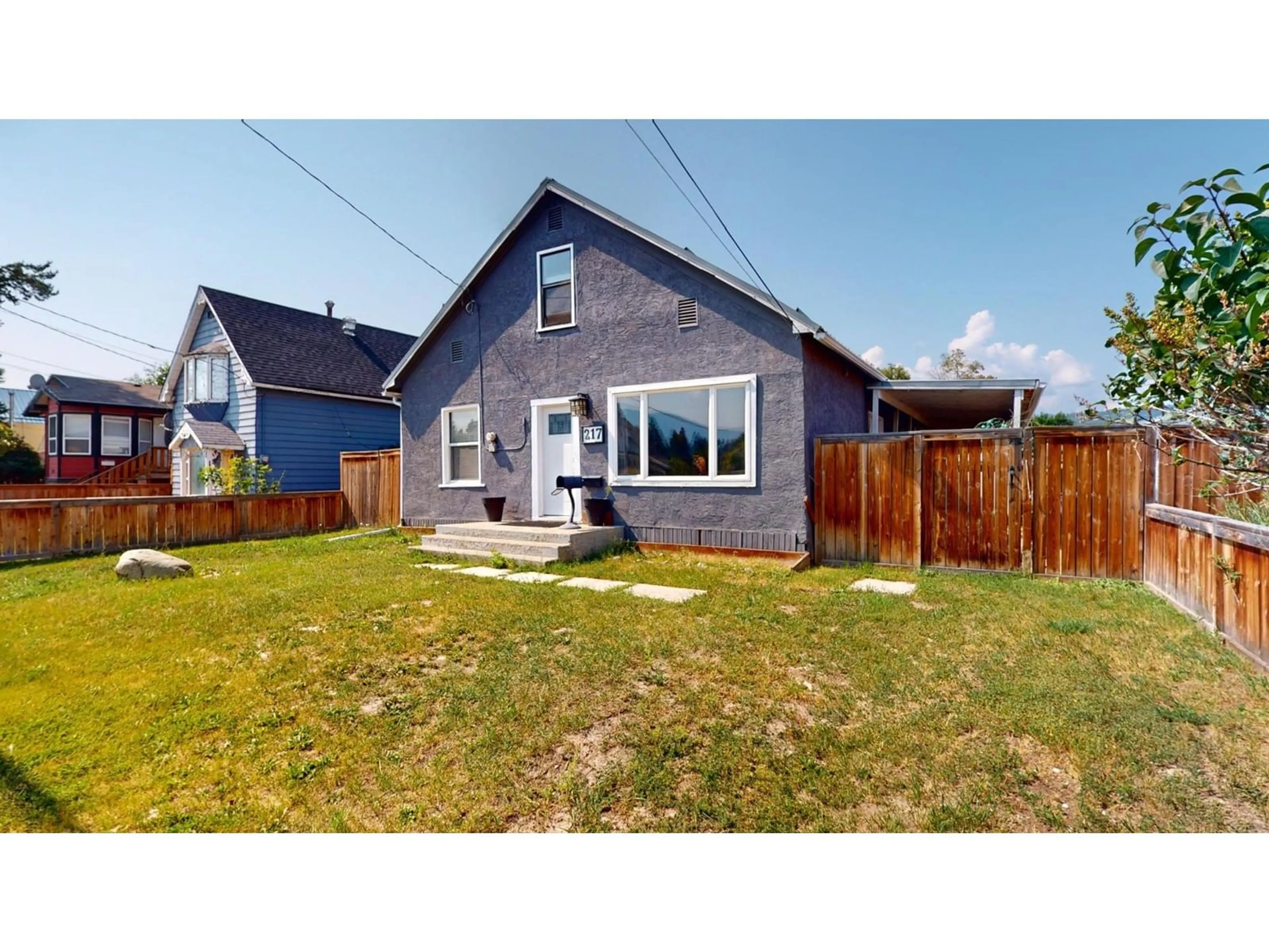 Frontside or backside of a home, the fenced backyard for 217 5TH  S Avenue, Cranbrook British Columbia V1C2G5