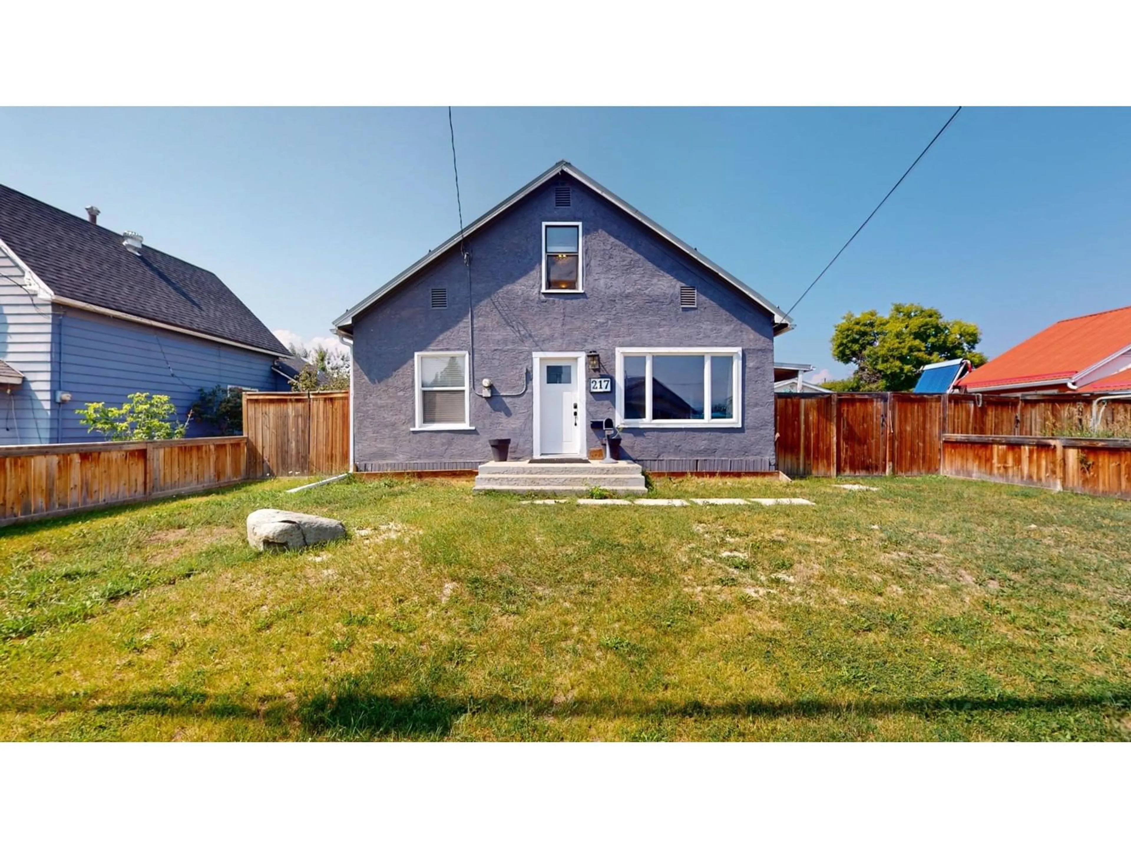 Frontside or backside of a home, the fenced backyard for 217 5TH  S Avenue, Cranbrook British Columbia V1C2G5