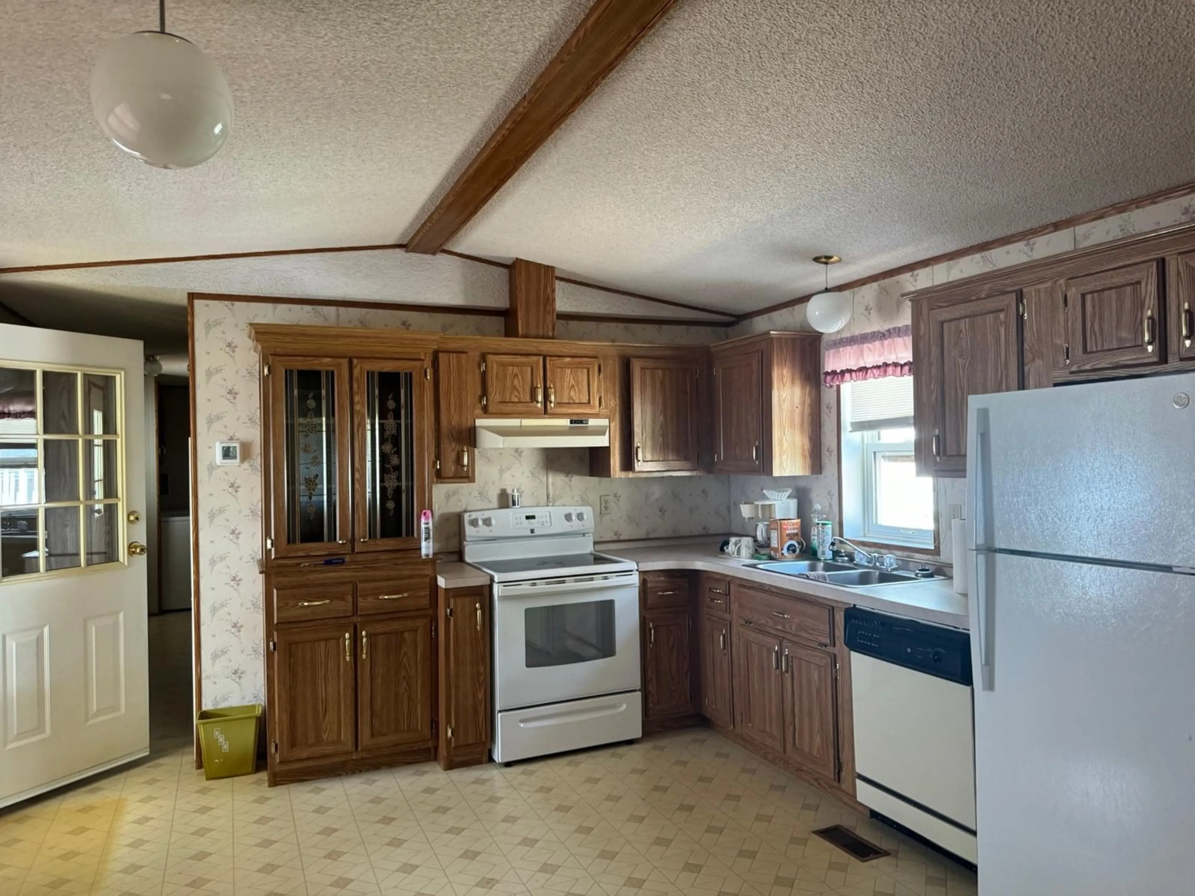 Standard kitchen, wood floors, cottage for 1421 ERICKSON Road Unit# 9, Creston British Columbia V0B1G1