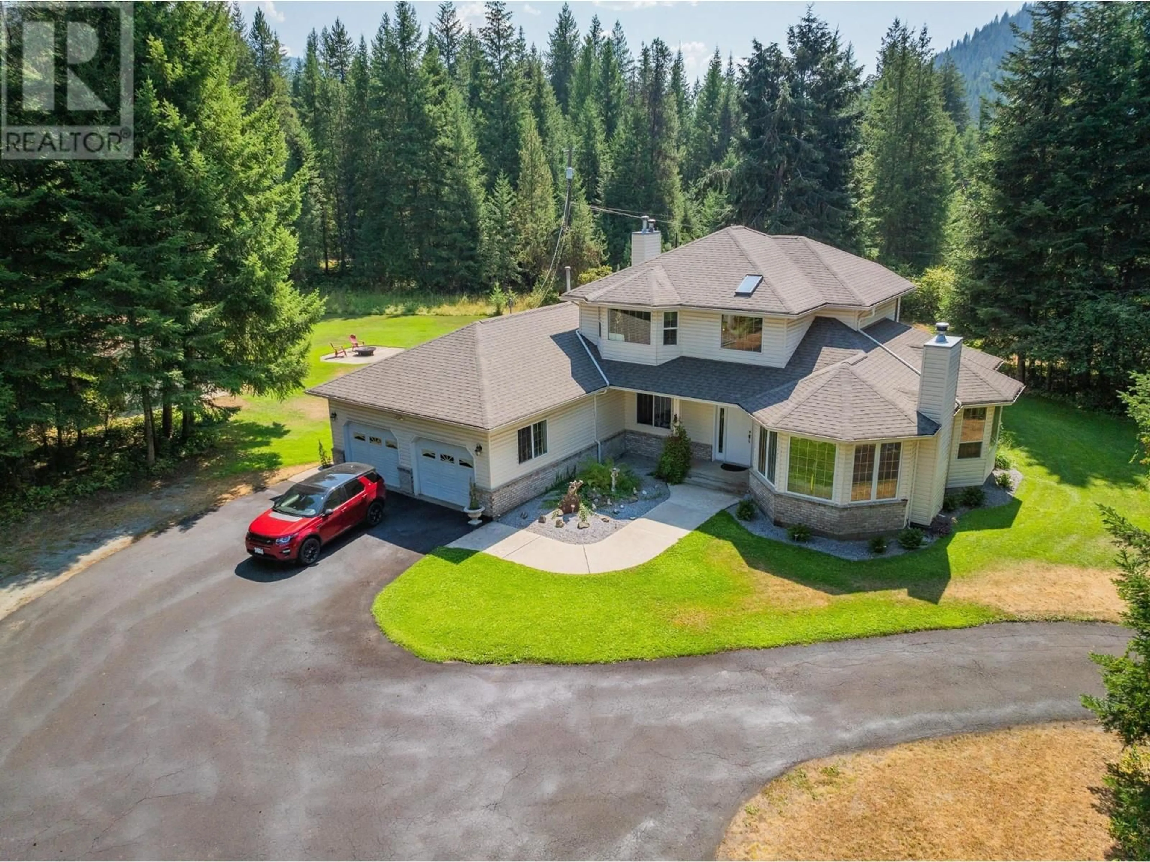 A pic from outside/outdoor area/front of a property/back of a property/a pic from drone, mountain view for 2718 OSACHOFF ROAD, South Slocan British Columbia V1N2C0