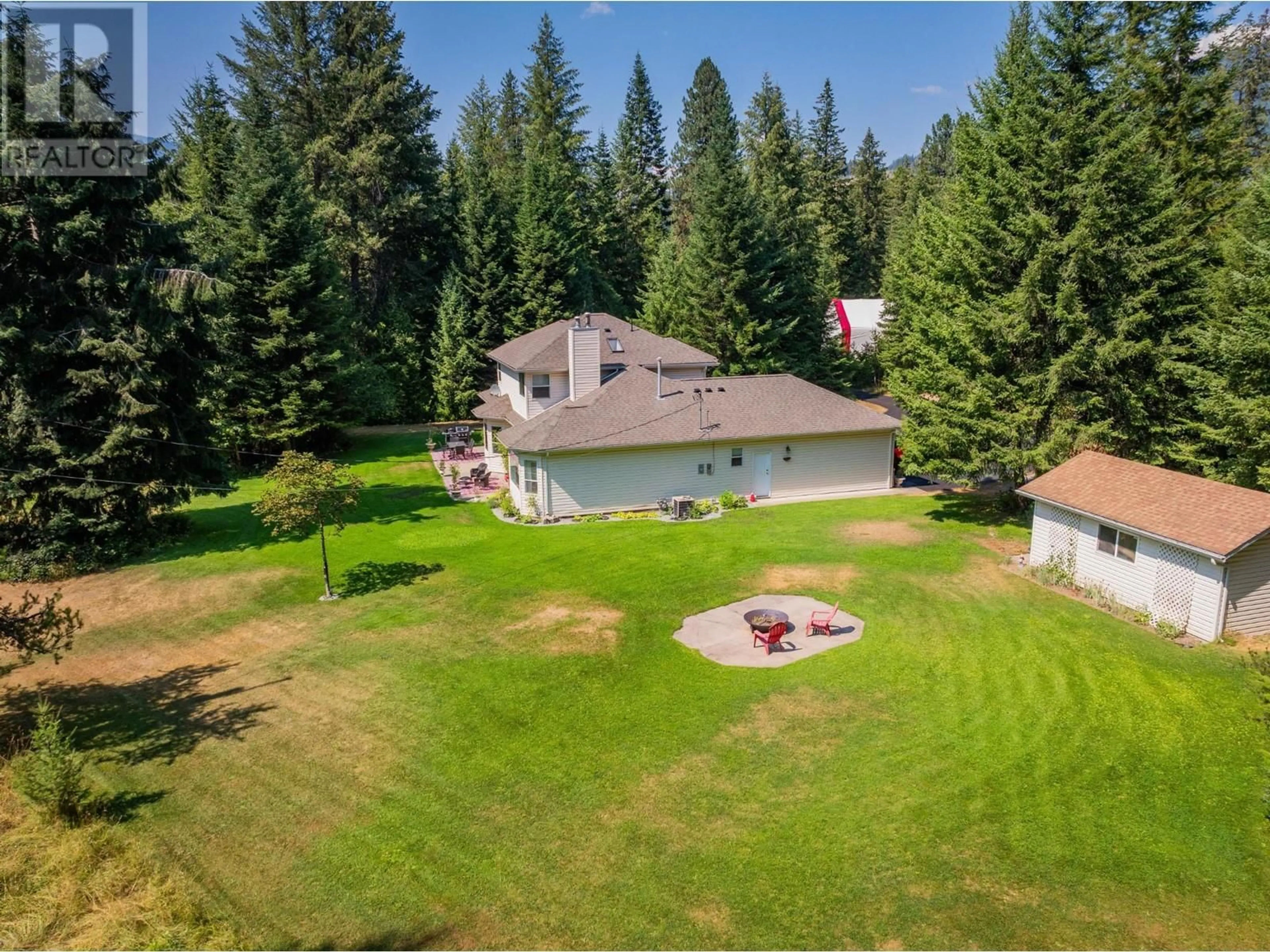 A pic from outside/outdoor area/front of a property/back of a property/a pic from drone, forest/trees view for 2718 OSACHOFF ROAD, South Slocan British Columbia V1N2C0