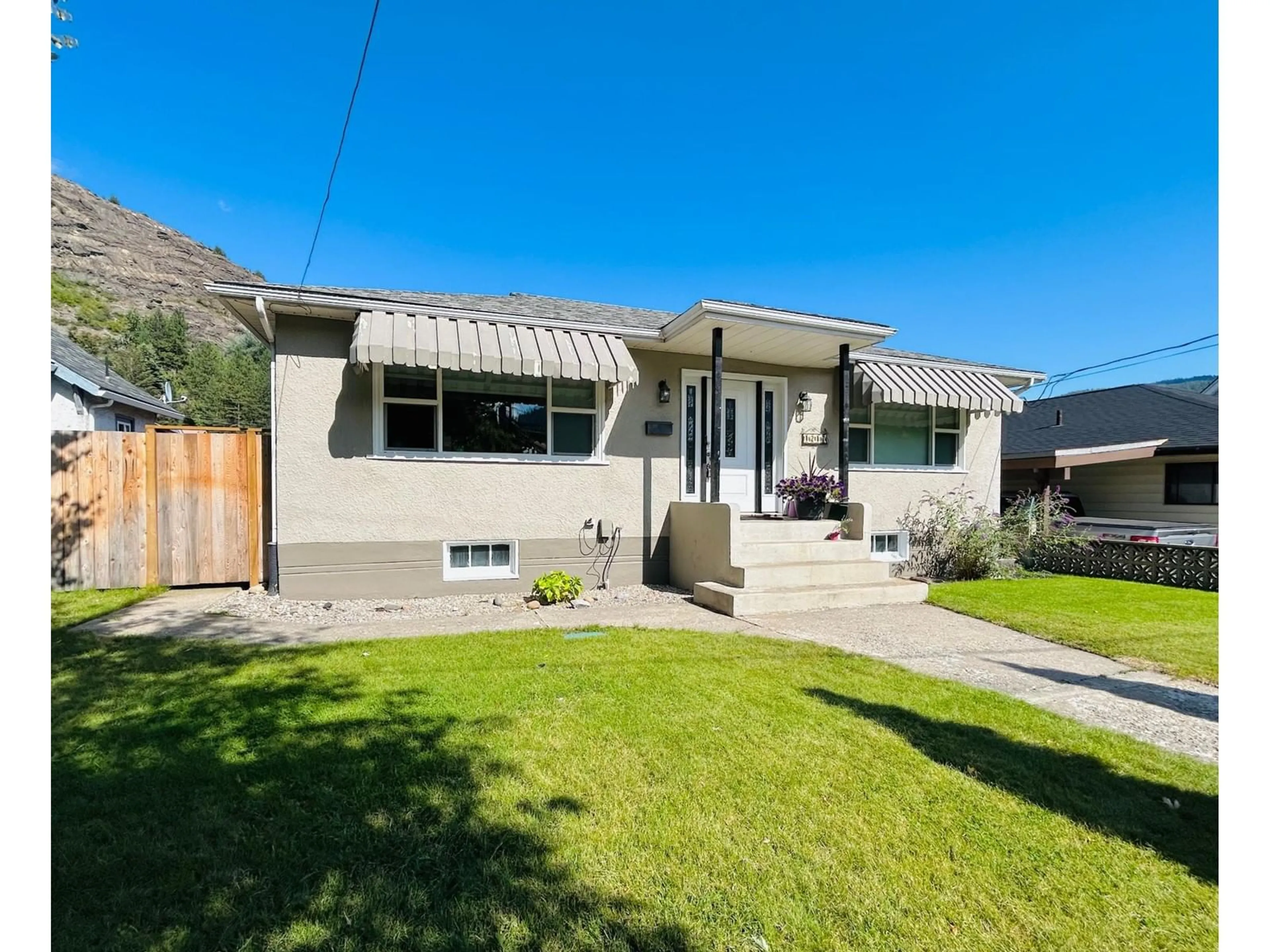 Frontside or backside of a home, the fenced backyard for 1217 COLUMBIA Avenue, Trail British Columbia V1R1J3