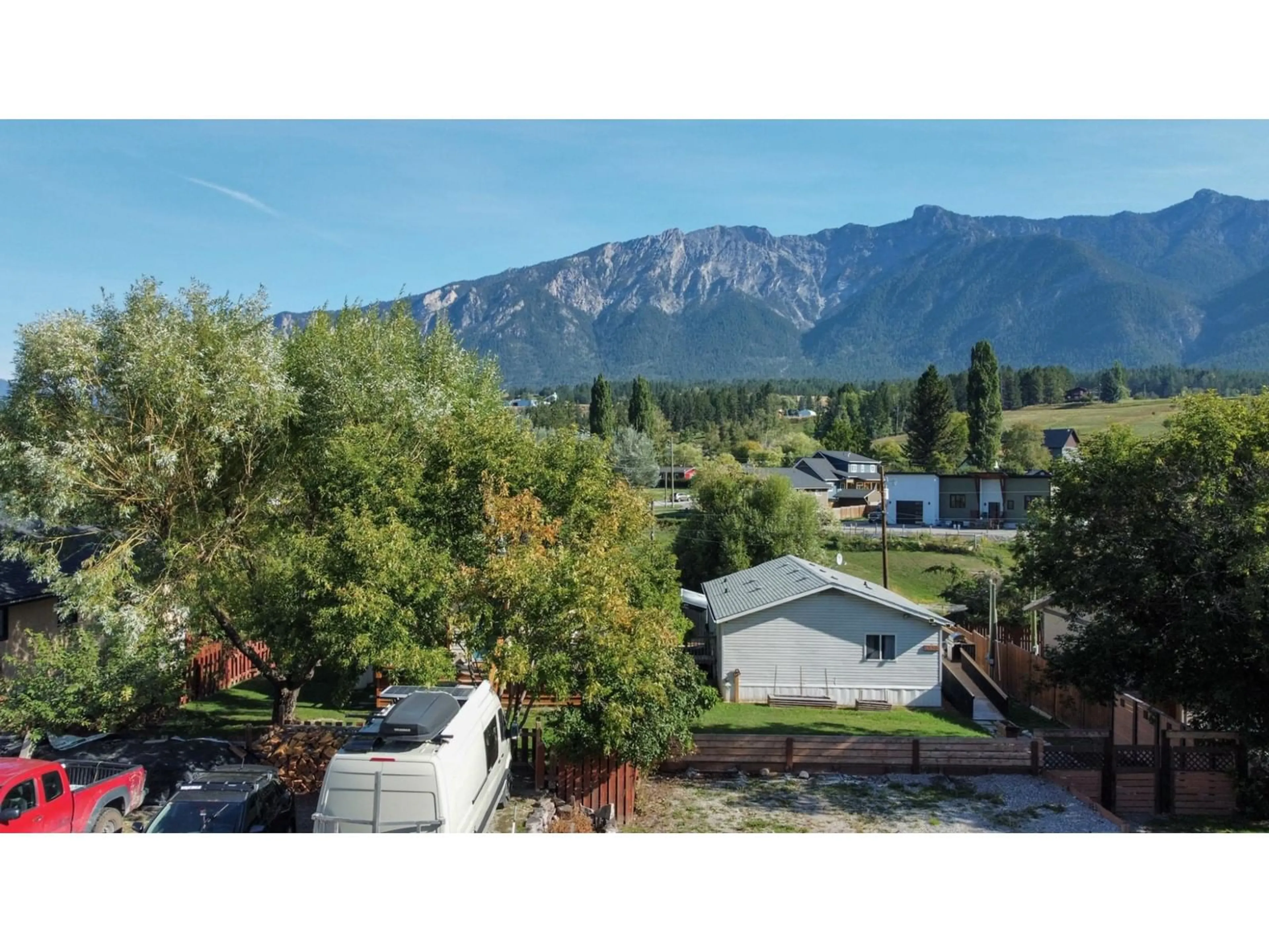 A pic from exterior of the house or condo, the fenced backyard for 4859 RIVERVIEW Drive, Edgewater British Columbia V0A1E0