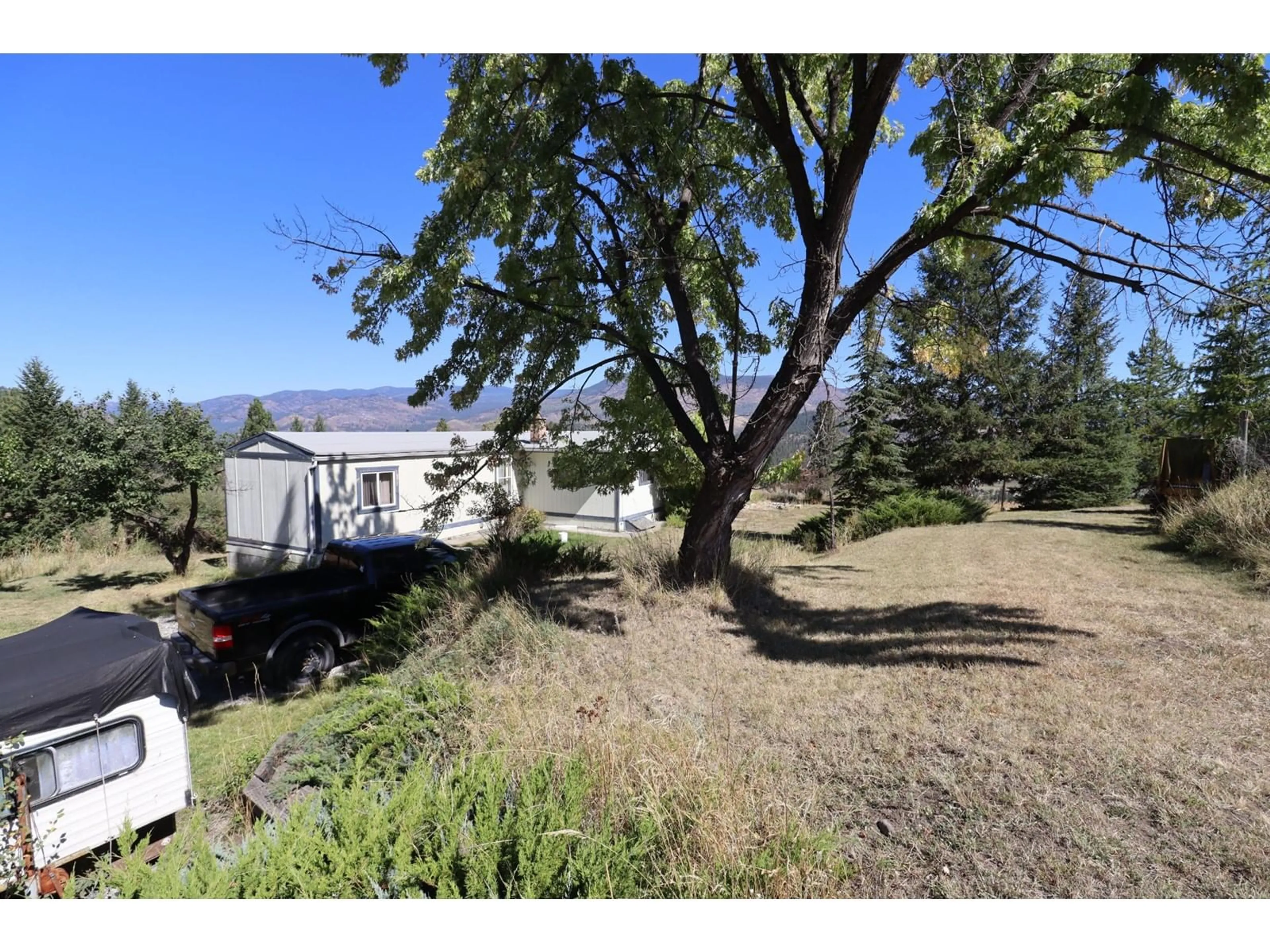 A pic from exterior of the house or condo, the fenced backyard for 3775 HARDY MOUNTAIN Road, Grand Forks British Columbia V0H1H2