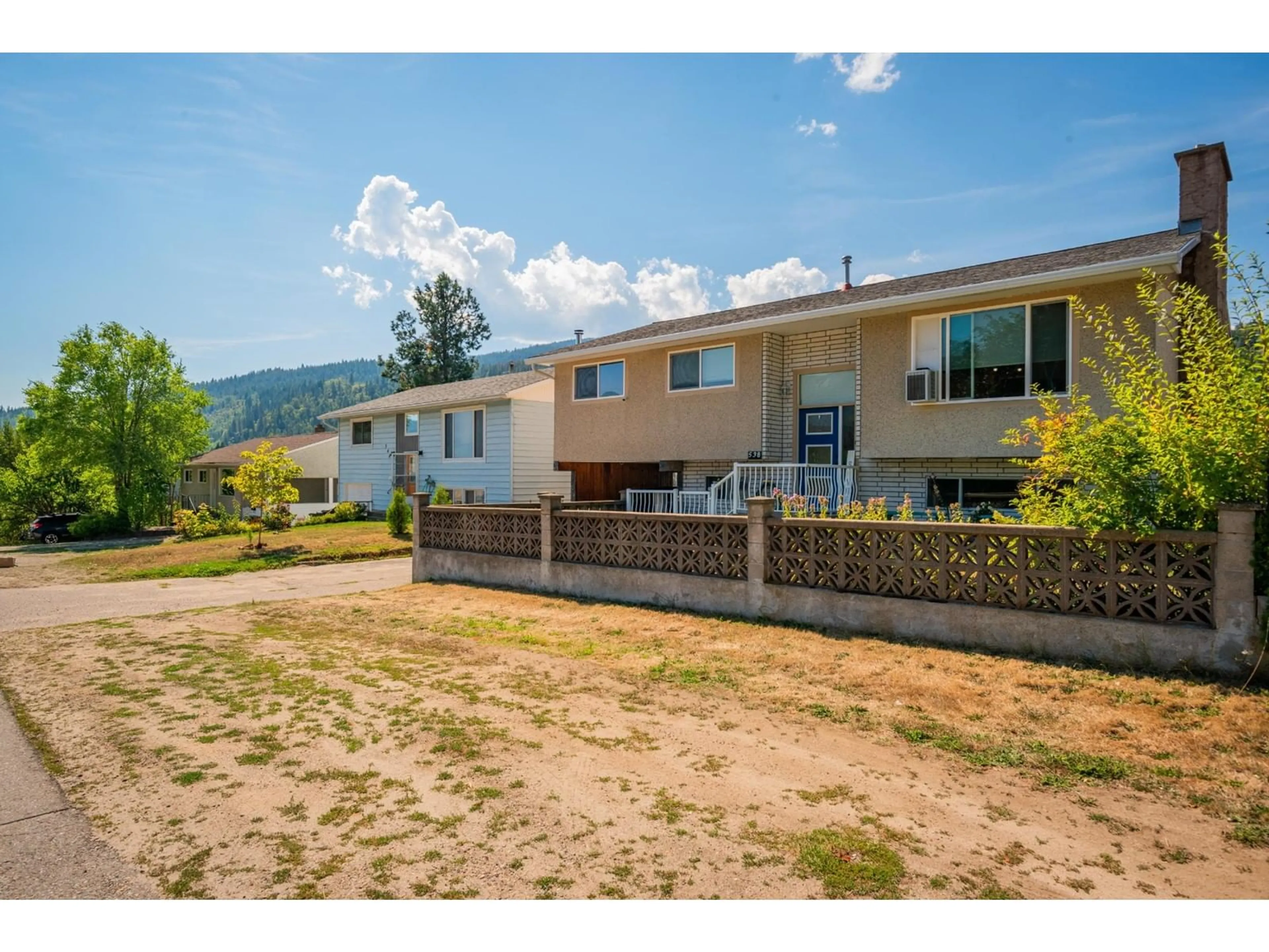 Frontside or backside of a home, the fenced backyard for 538 7TH Avenue, Castlegar British Columbia V1N1R4