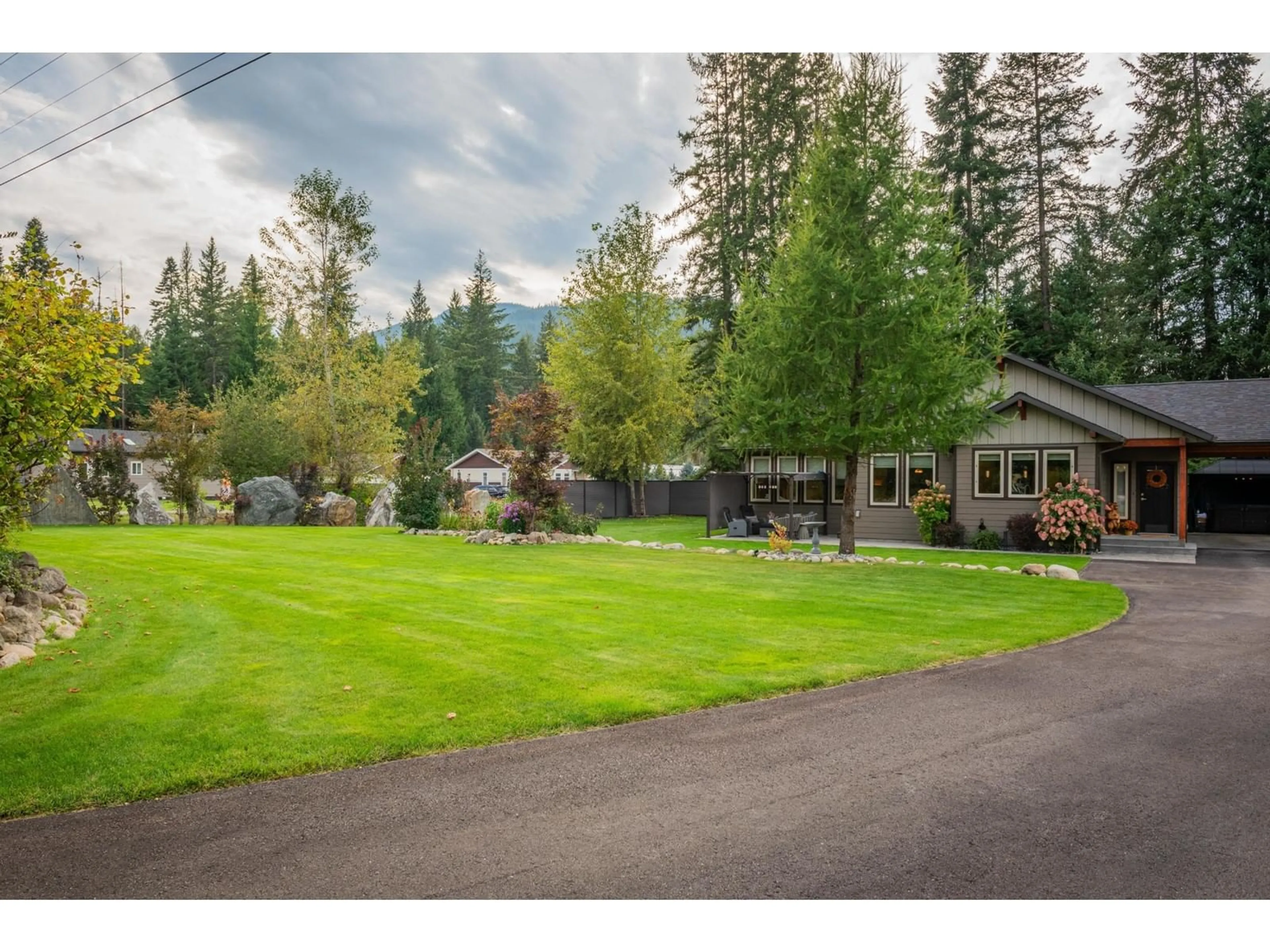 Frontside or backside of a home, the fenced backyard for 2711 JACKS Crescent, South Slocan British Columbia V1N2G1