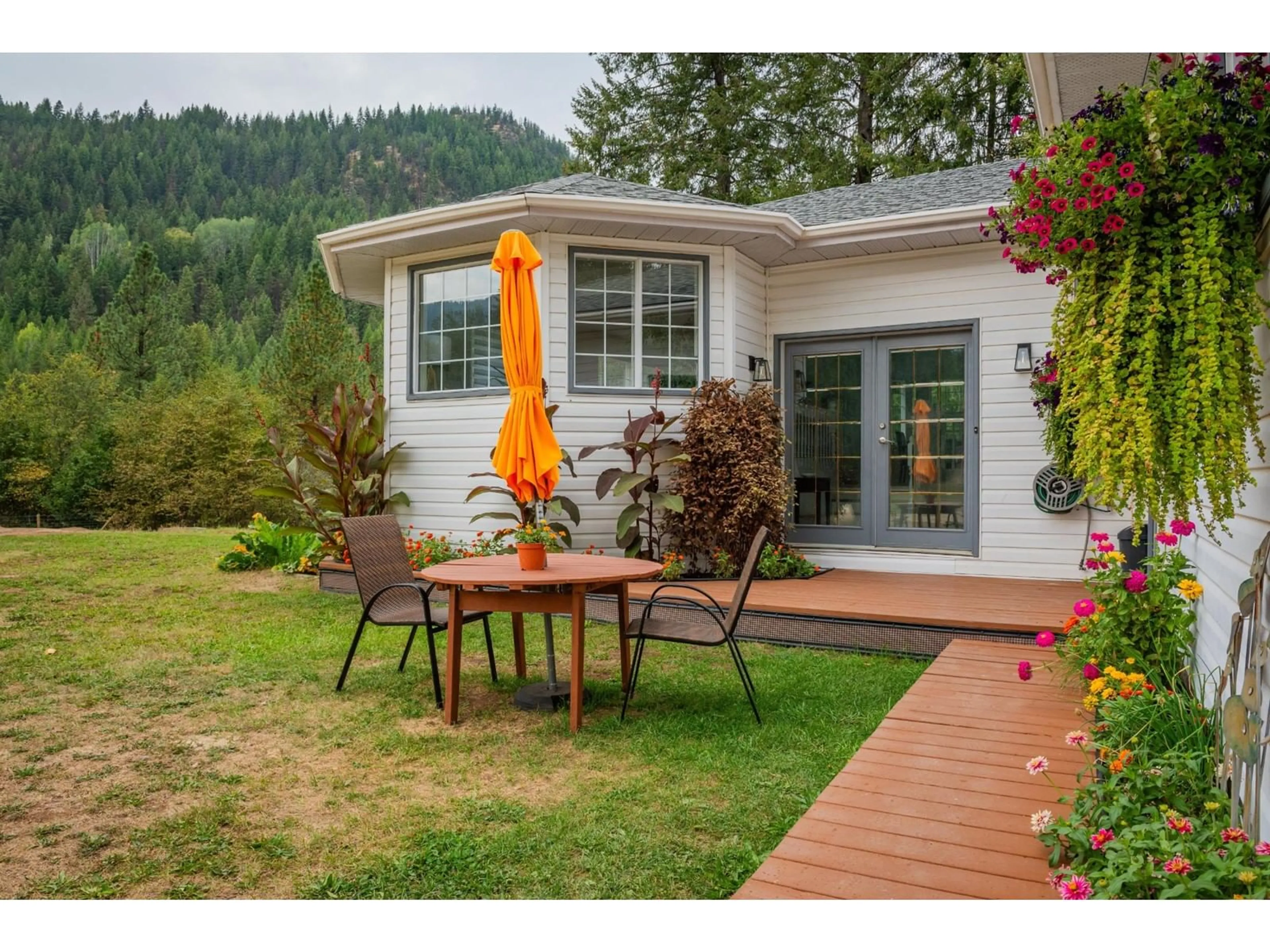 Patio, the fenced backyard for 2697 OSACHOFF Road, South Slocan British Columbia V0G2G0