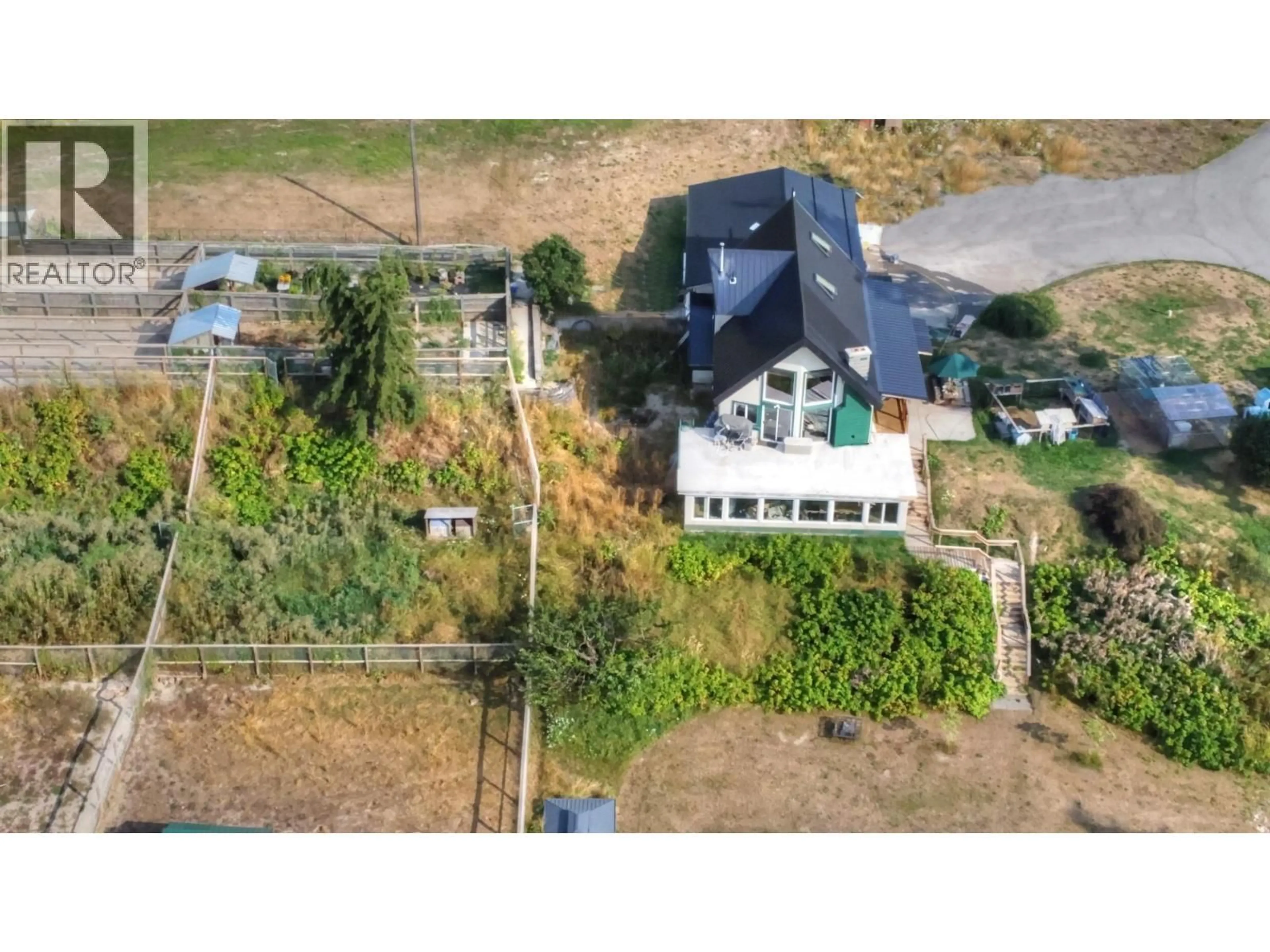 A pic from outside/outdoor area/front of a property/back of a property/a pic from drone, building for 4008 ARROW PARK FRONTAGE ROAD, Arrow Park British Columbia V0G1R1