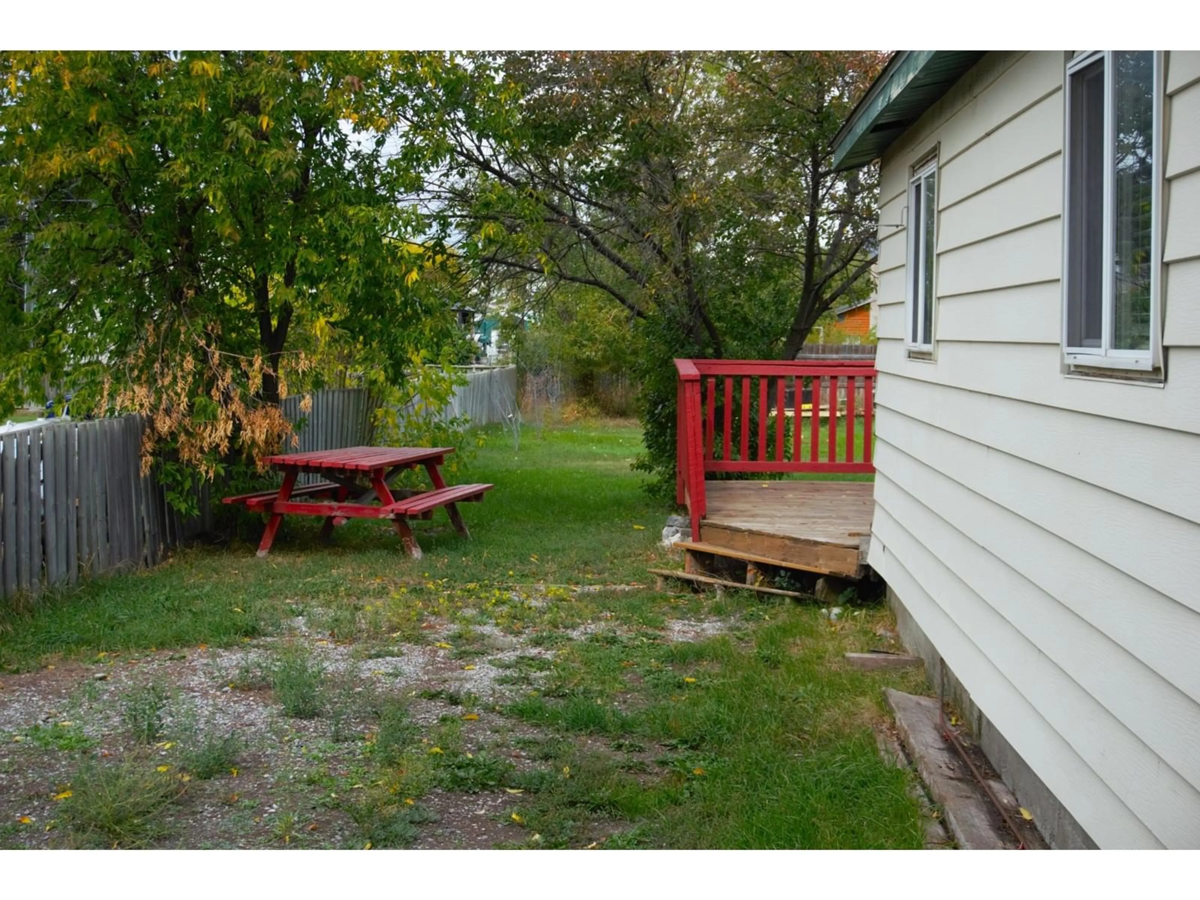 Patio, the fenced backyard for 4953 STEVENS Avenue, Canal Flats British Columbia V0B1B0