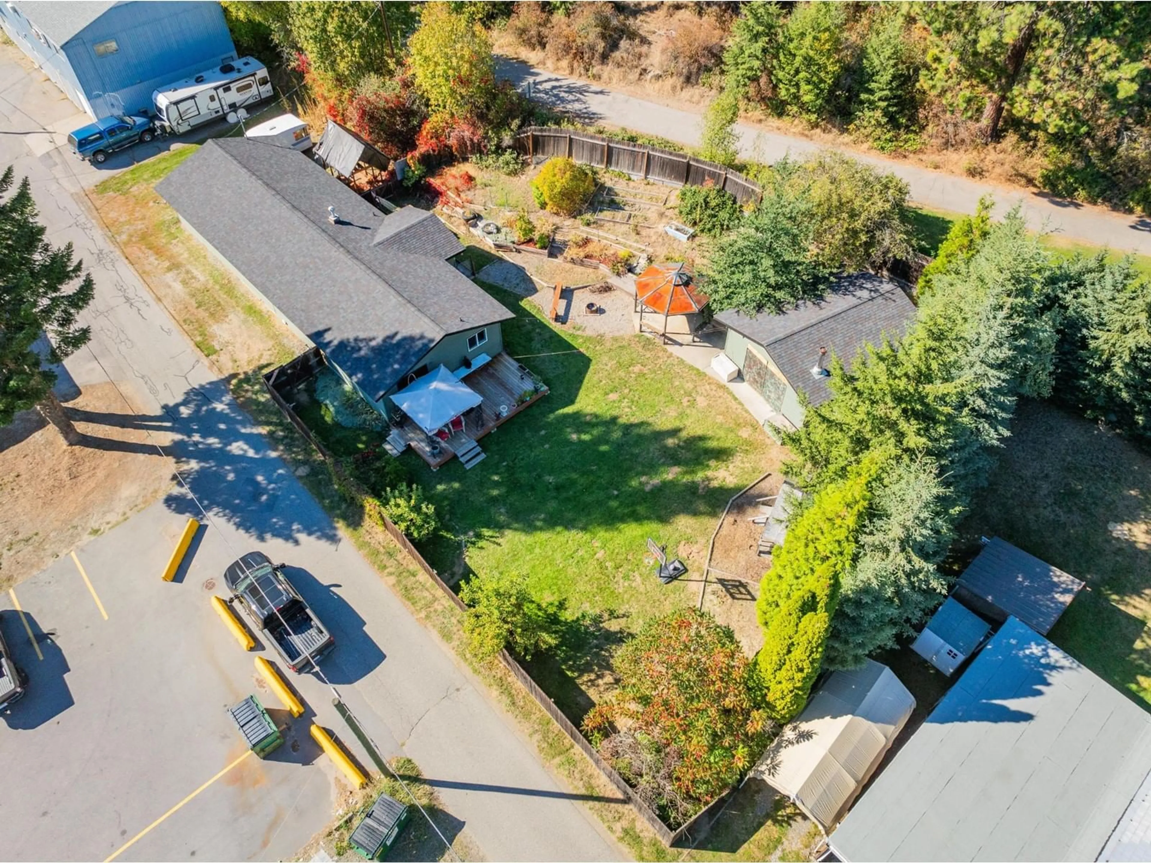 Frontside or backside of a home, the fenced backyard for 625 11TH Avenue, Montrose British Columbia V0G1P0