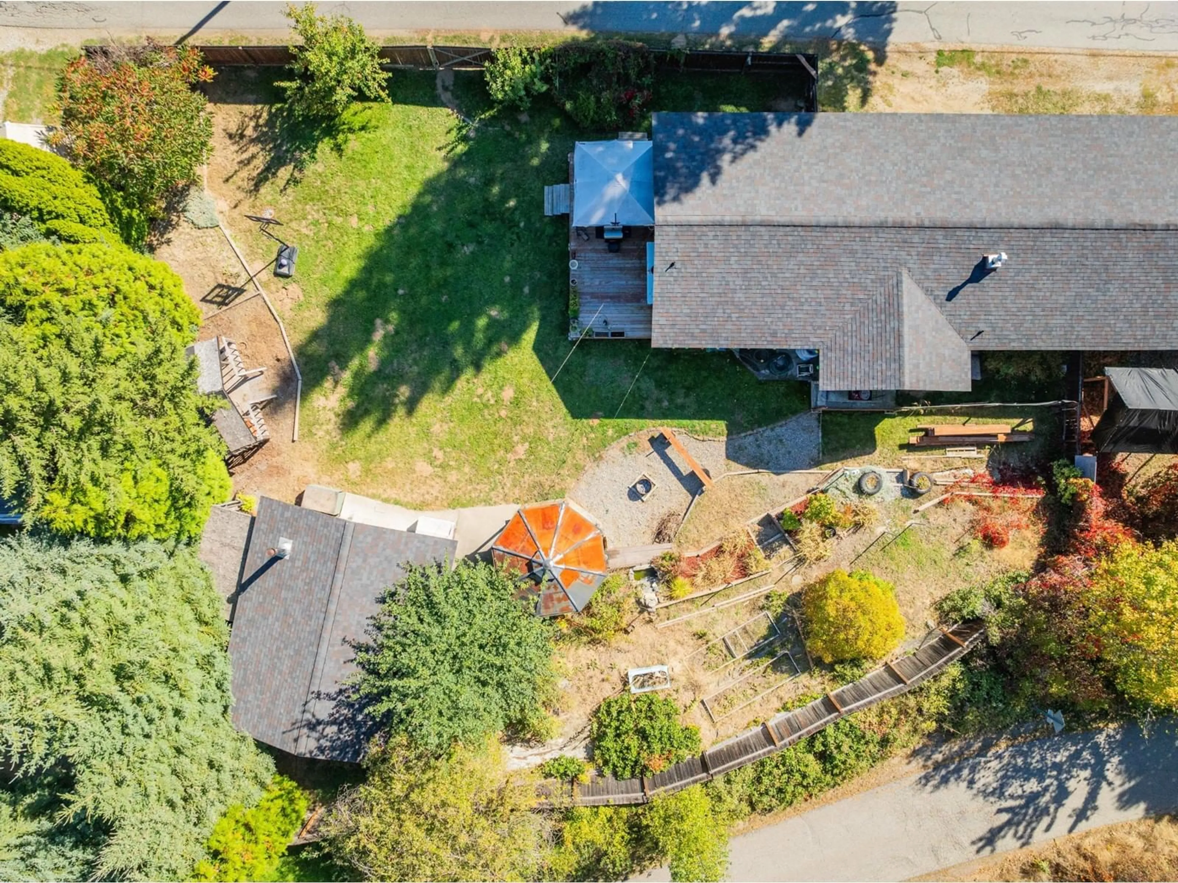 Frontside or backside of a home, the fenced backyard for 625 11TH Avenue, Montrose British Columbia V0G1P0