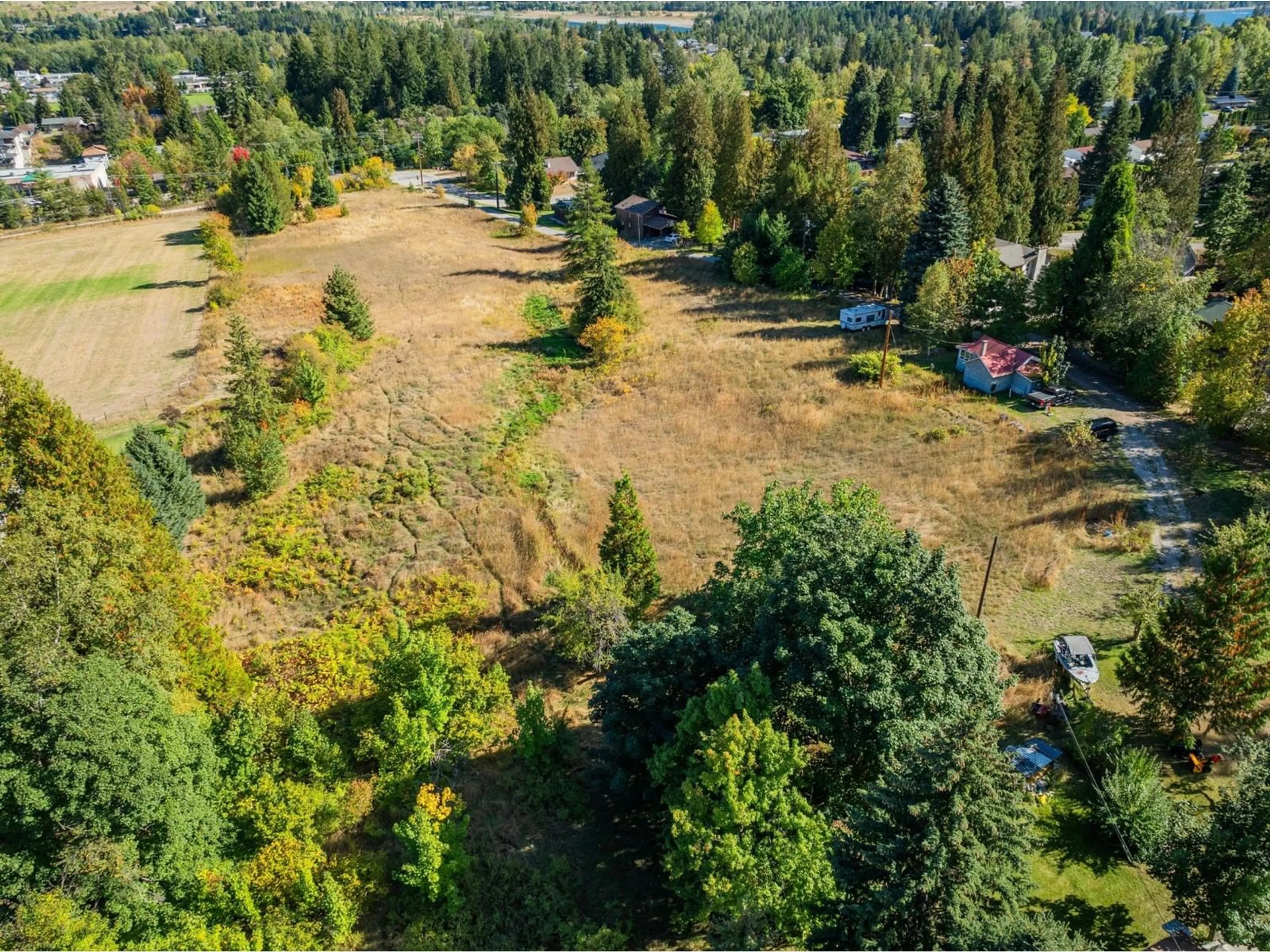 A pic from exterior of the house or condo, the fenced backyard for 738 MEADOWLARK Lane, Castlegar British Columbia V1N2K4