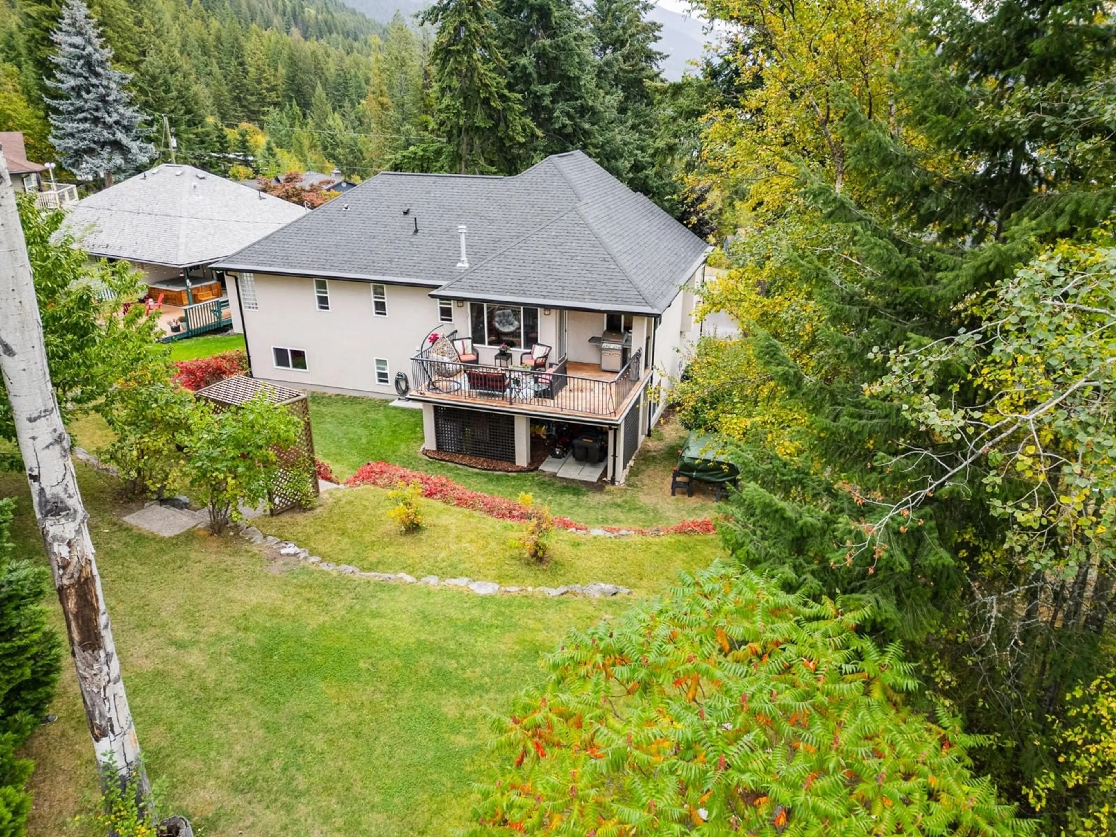 Frontside or backside of a home, the fenced backyard for 3435 BODARD Drive, Nelson British Columbia V1L6T3