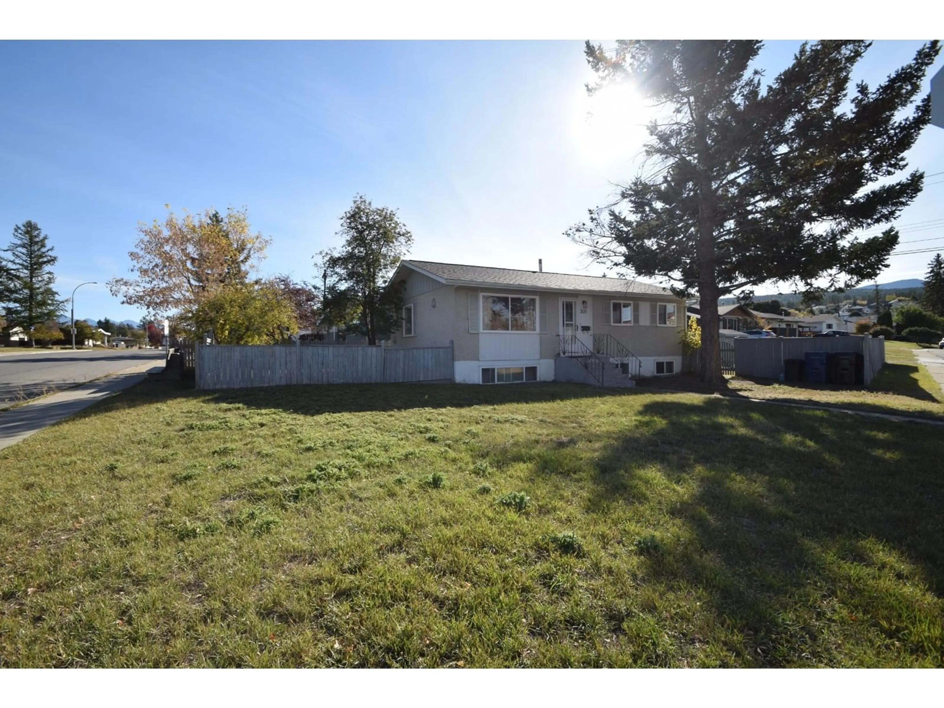 Frontside or backside of a home, the fenced backyard for 301 11TH  S Street, Cranbrook British Columbia V1C1V1