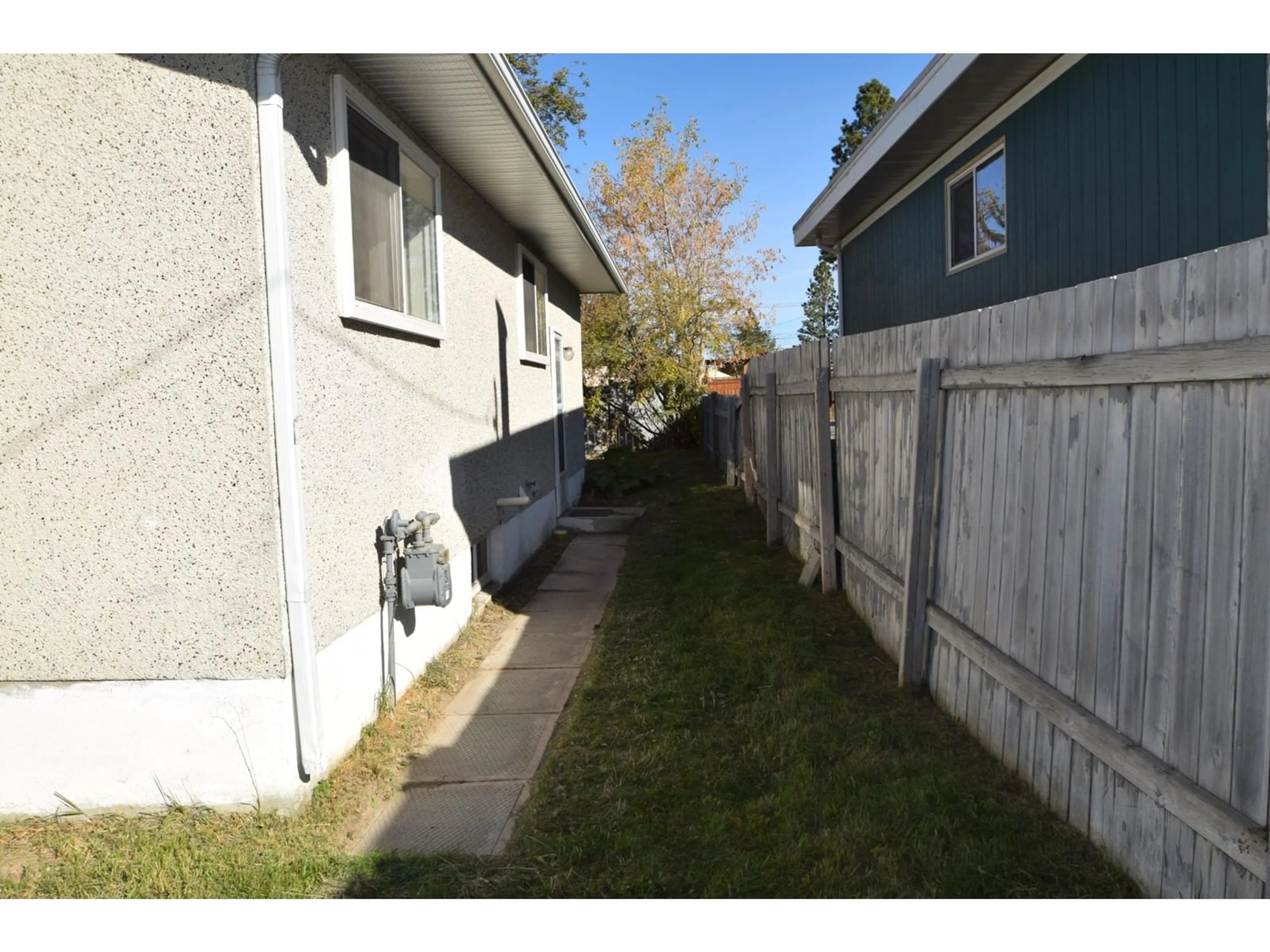 Frontside or backside of a home, the fenced backyard for 301 11TH  S Street, Cranbrook British Columbia V1C1V1