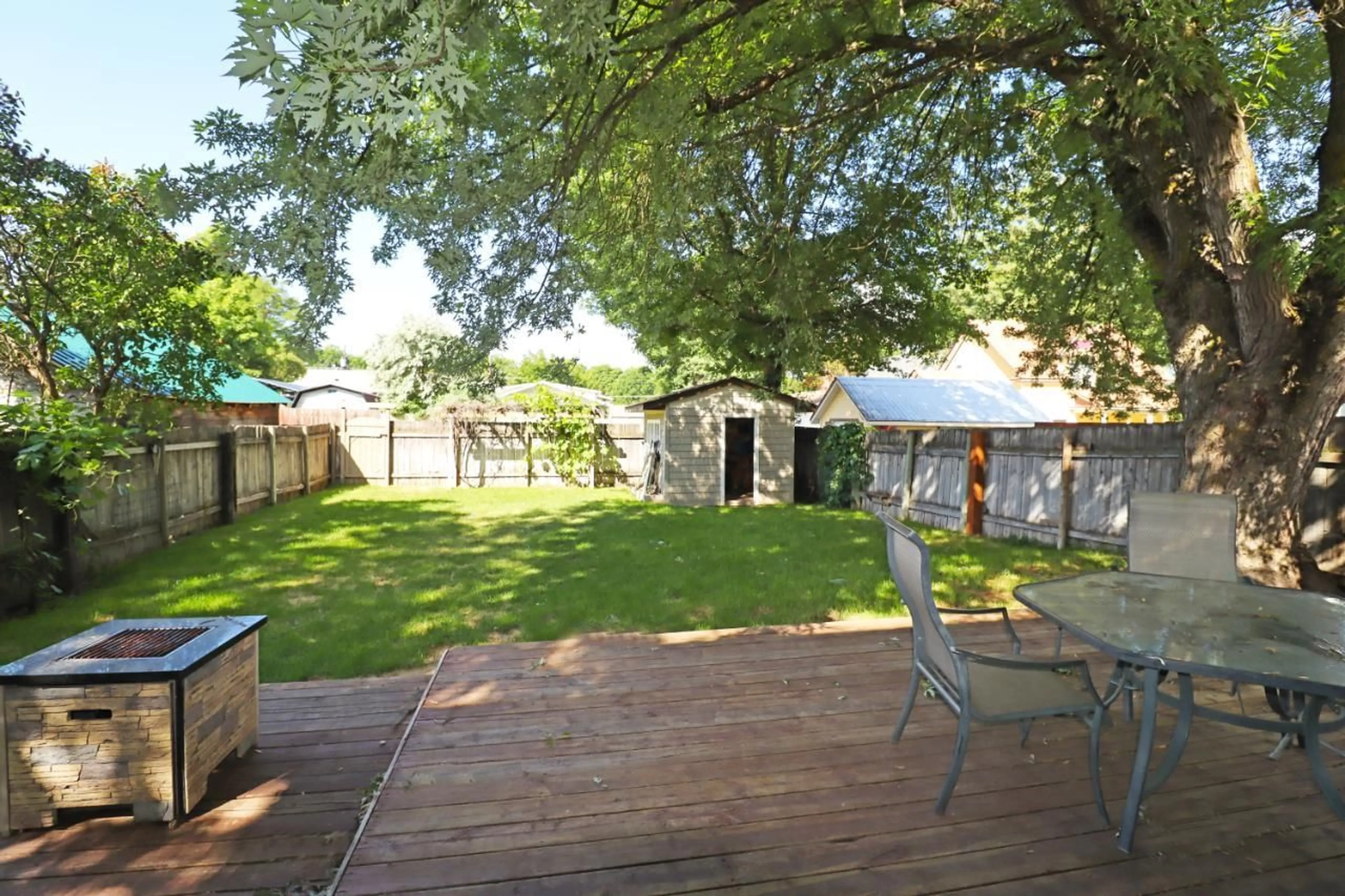 Patio, the fenced backyard for 7357 9TH Street, Grand Forks British Columbia V0H1H0