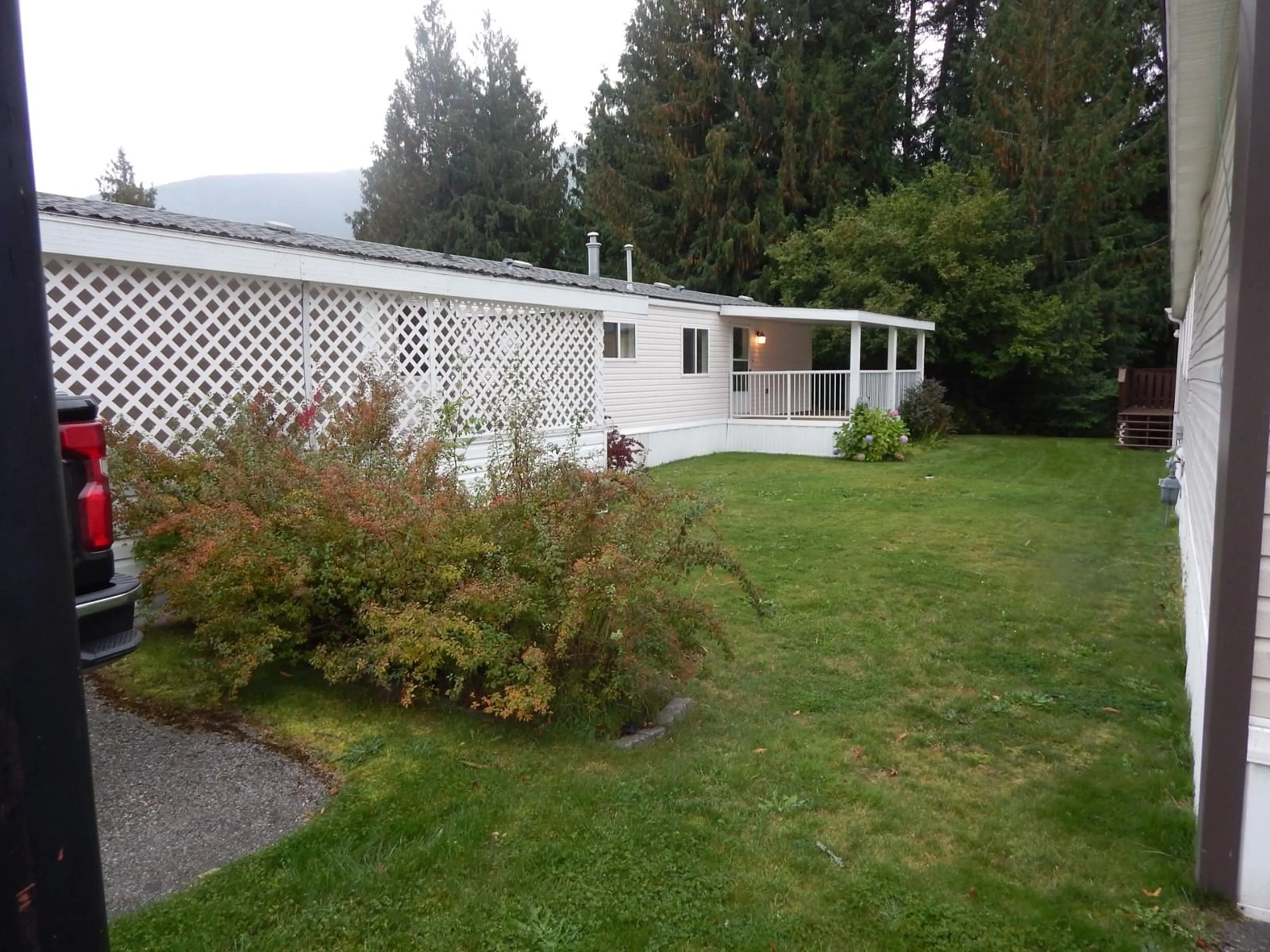 A pic from exterior of the house or condo, the fenced backyard for 7126 3A Highway Unit# #35, Balfour British Columbia V1L6S3