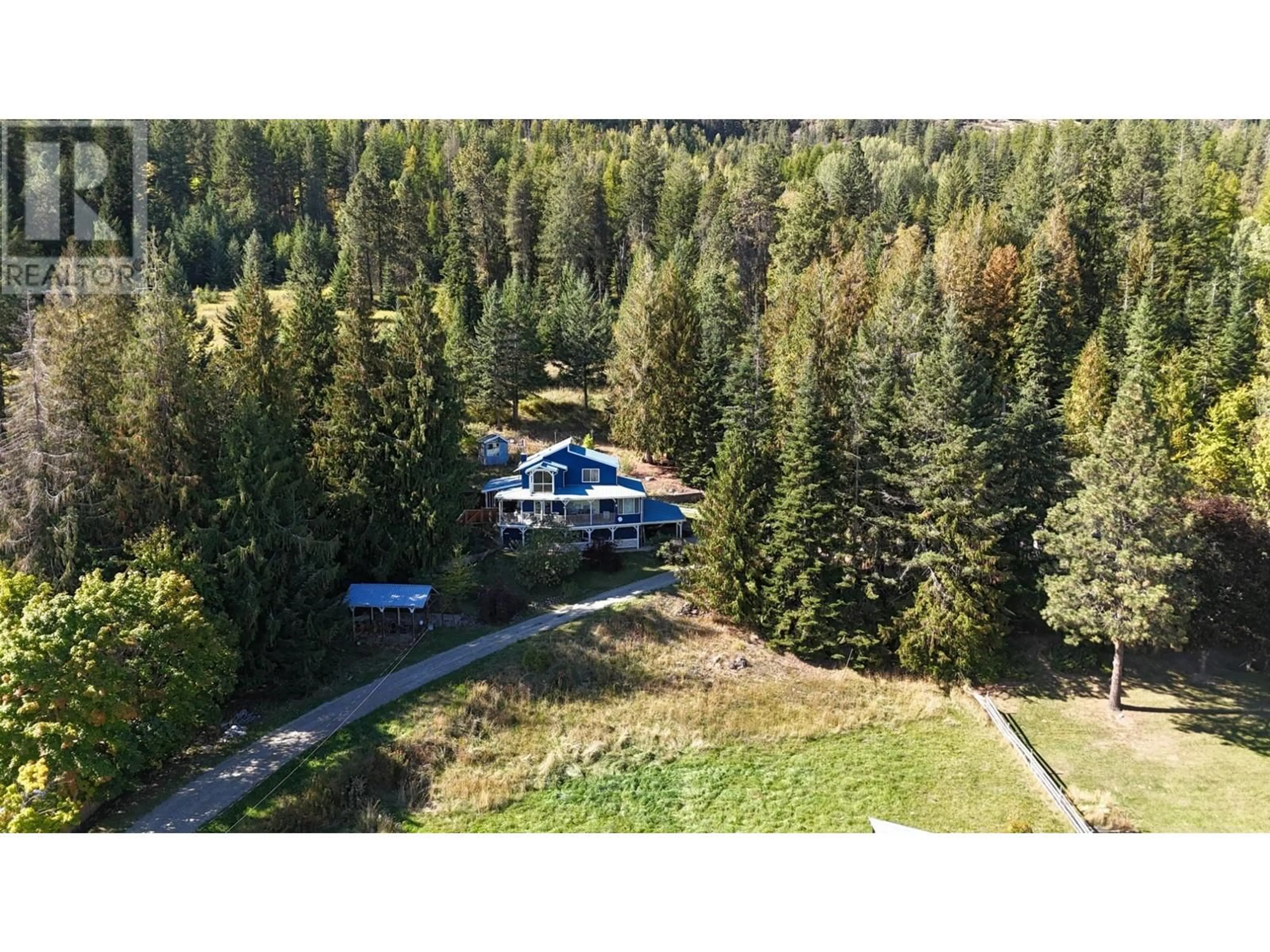 A pic from outside/outdoor area/front of a property/back of a property/a pic from drone, forest/trees view for 1621 EVANS ROAD, Creston British Columbia V0B1G7