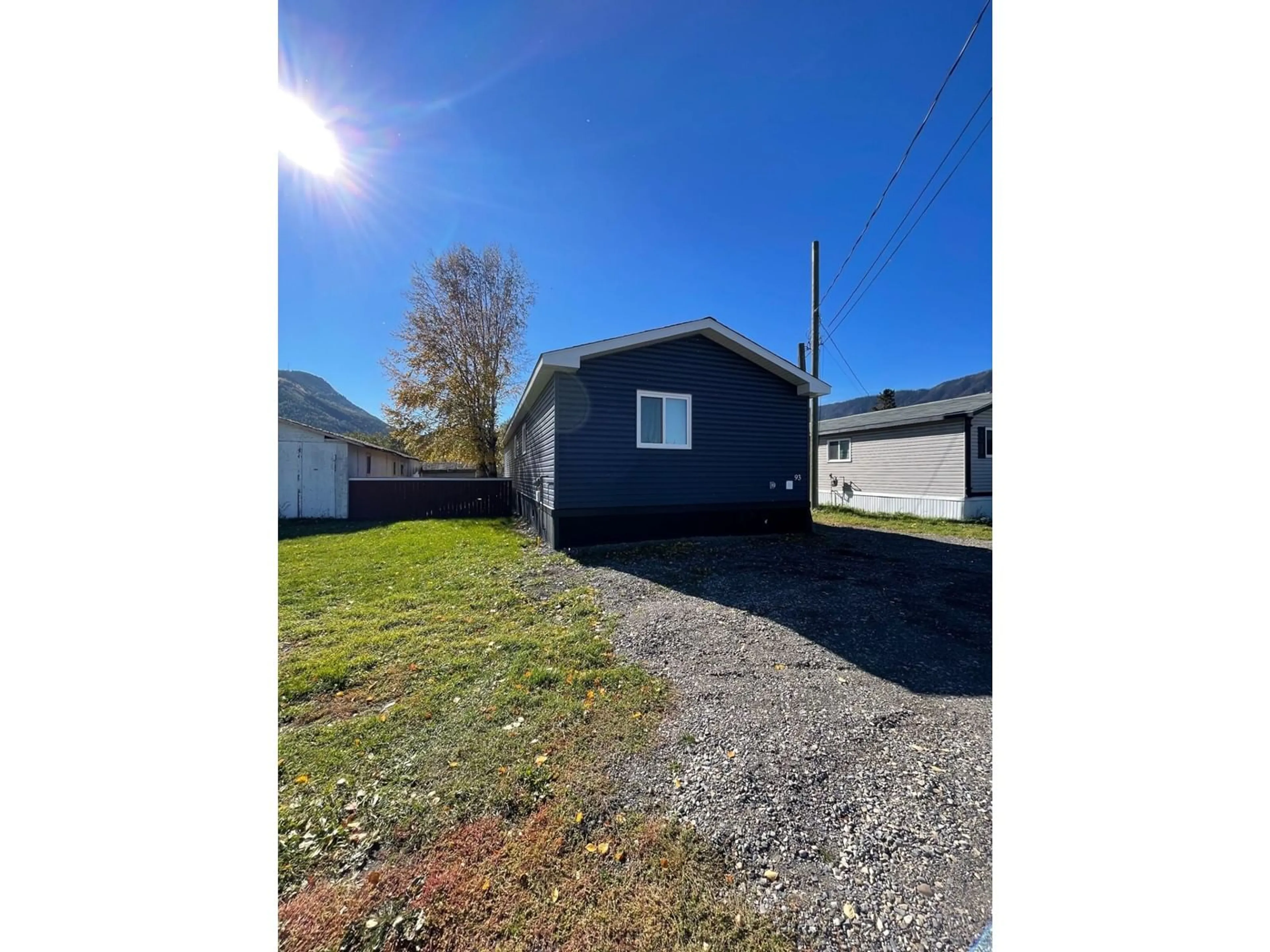 Frontside or backside of a home, the fenced backyard for 100 INDUSTRIAL  1 Road Unit# 93, Sparwood British Columbia V0B2G1