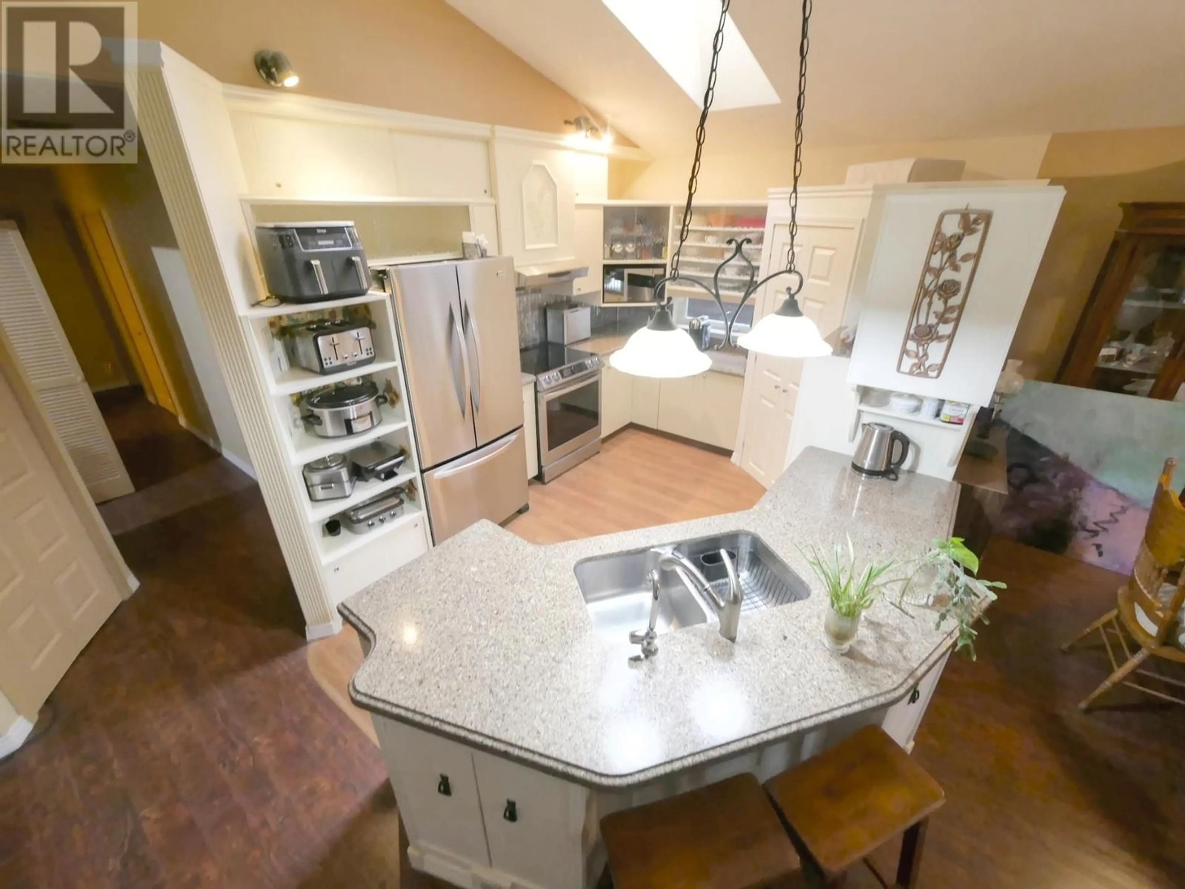 Open concept kitchen, ceramic/tile floor for 930 CHINA CREEK ROAD, Genelle British Columbia V0G1G0