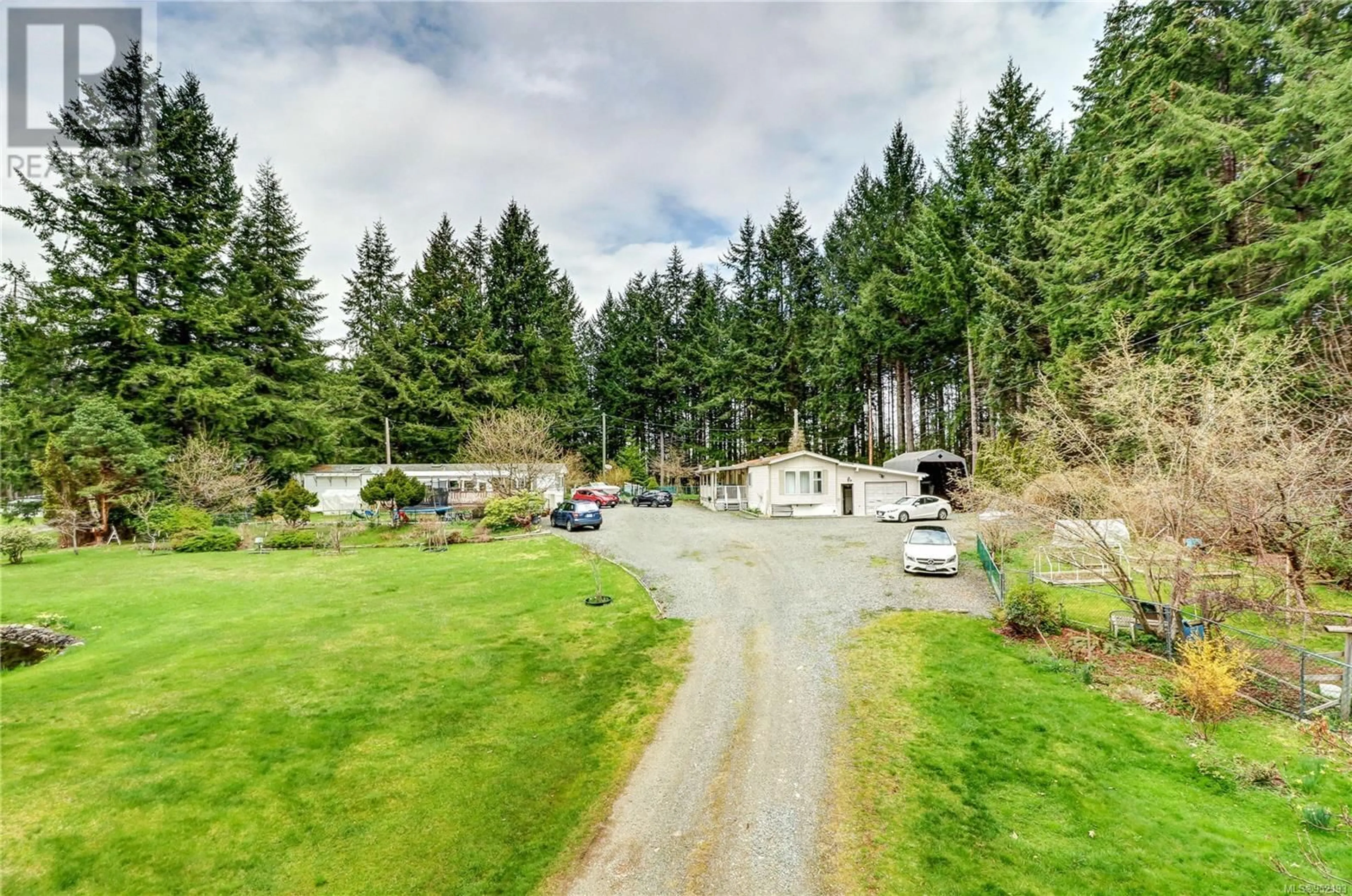 A pic from outside/outdoor area/front of a property/back of a property/a pic from drone, mountain view for A & B - 2826 BRUCE ROAD, Black Creek British Columbia V9J1B7