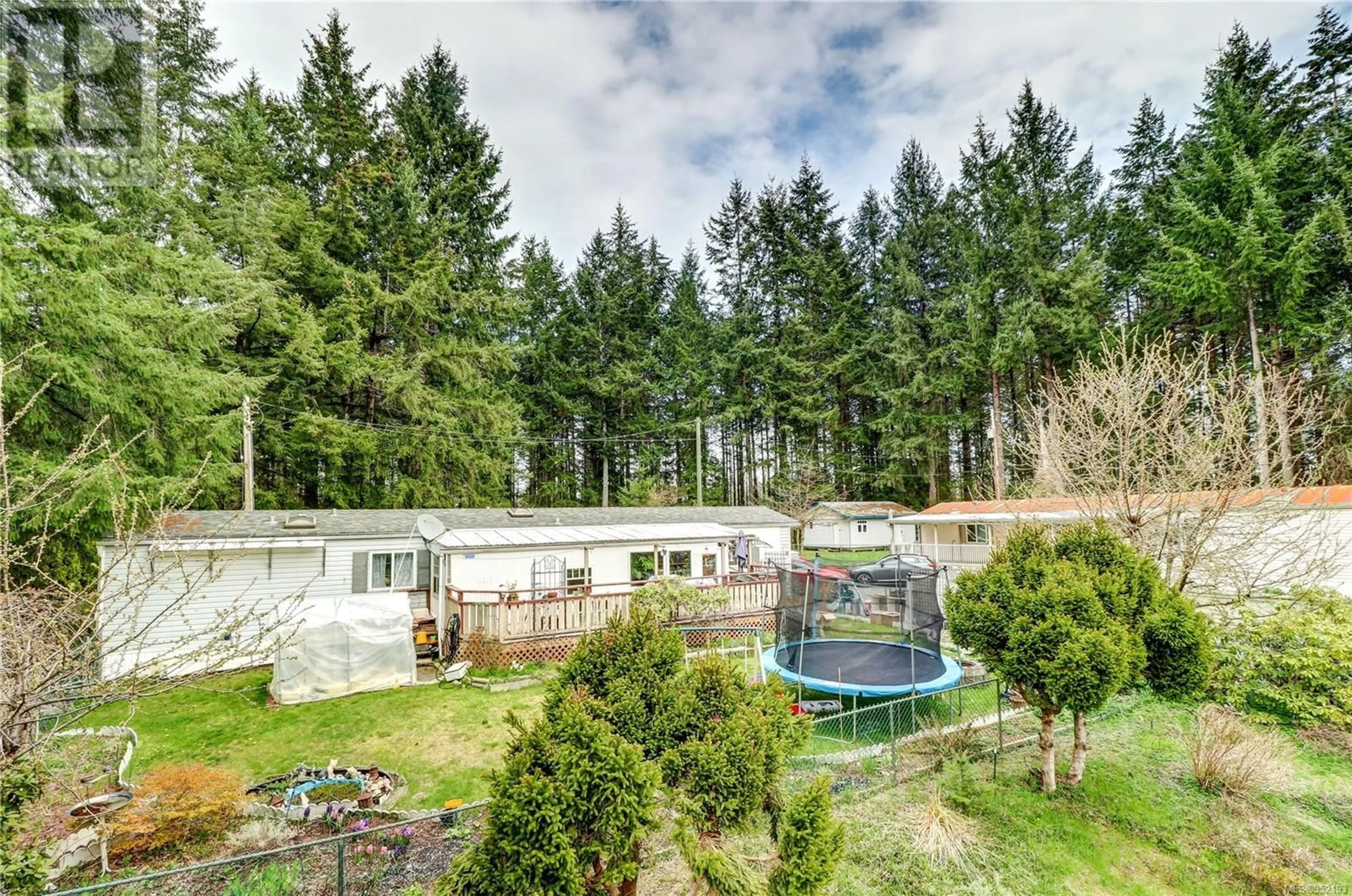 A pic from outside/outdoor area/front of a property/back of a property/a pic from drone, forest/trees view for A & B - 2826 BRUCE ROAD, Black Creek British Columbia V9J1B7