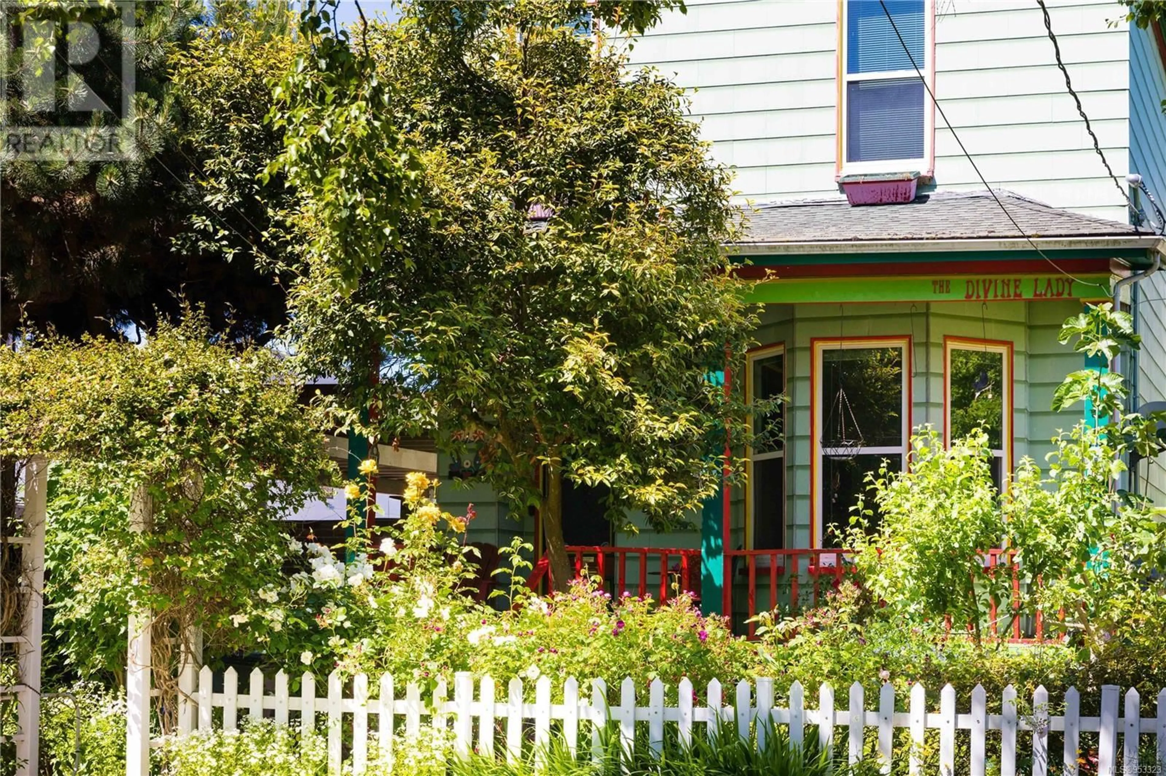 Frontside or backside of a home, the fenced backyard for 1044 Burdett Ave, Victoria British Columbia V8V3H1