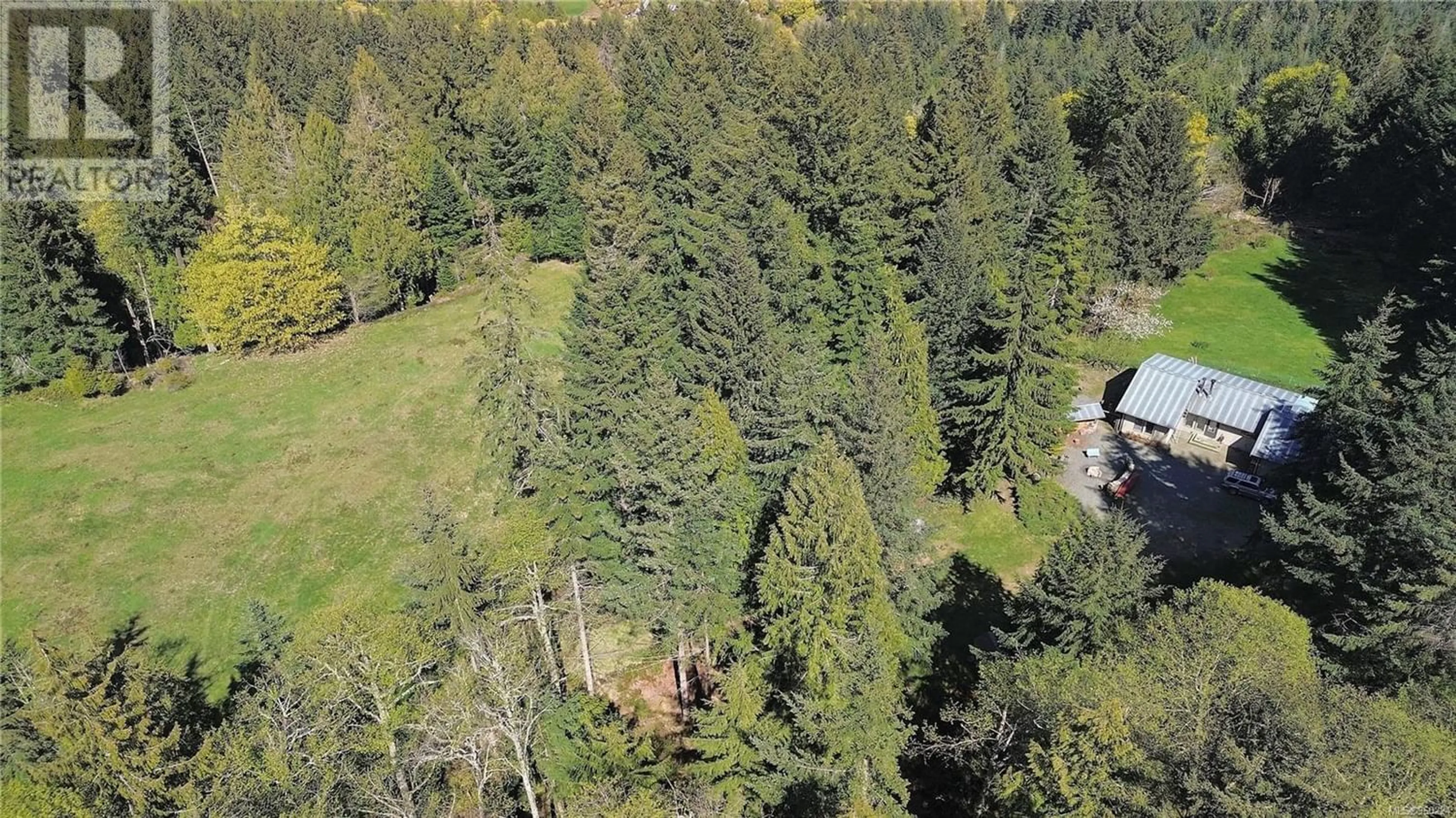 A pic from outside/outdoor area/front of a property/back of a property/a pic from drone, forest/trees view for 444 Blackburn Rd, Salt Spring British Columbia V8K2H2