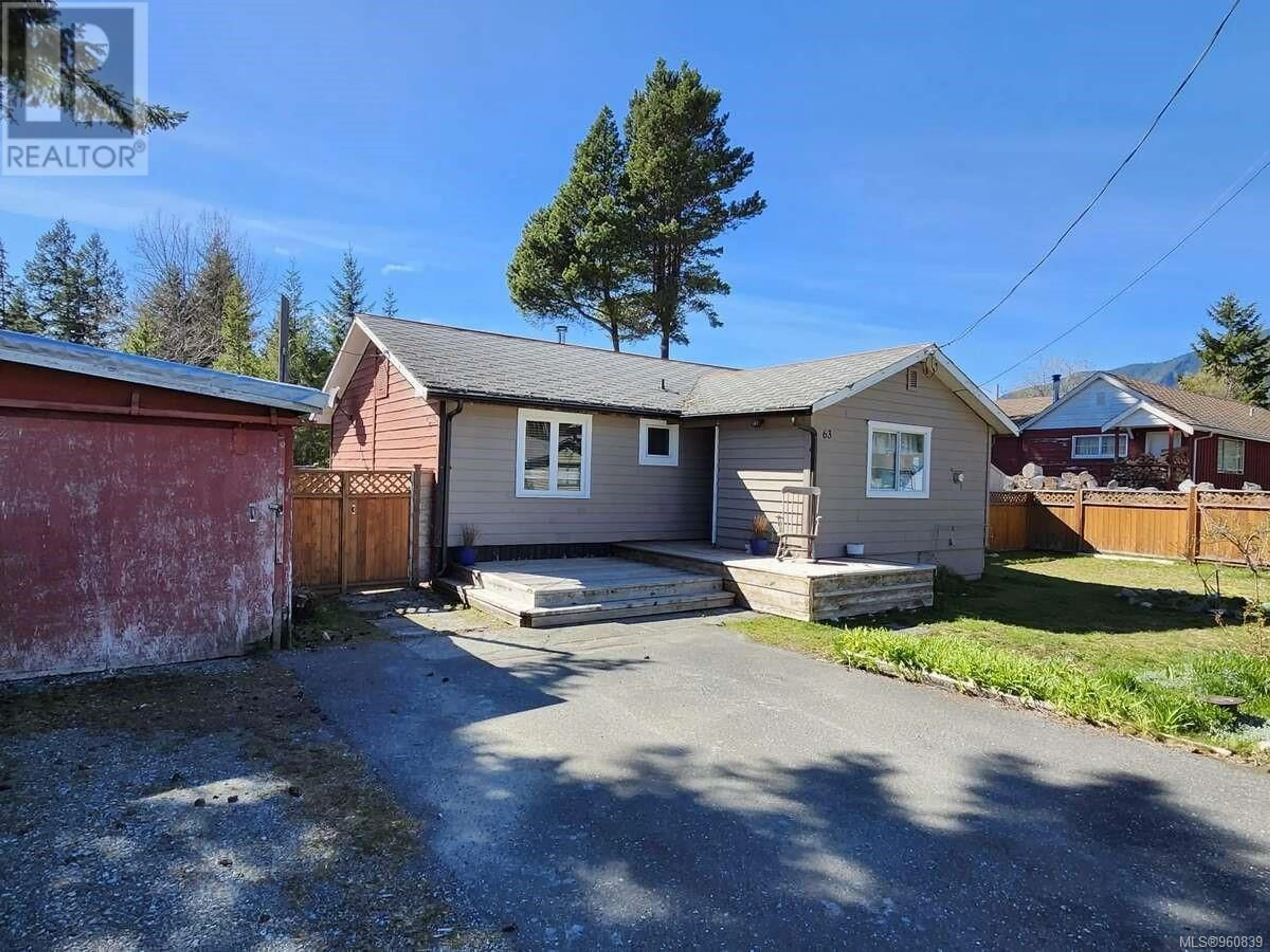 Frontside or backside of a home for 63 Kinman Ave, Woss British Columbia V0N3P0
