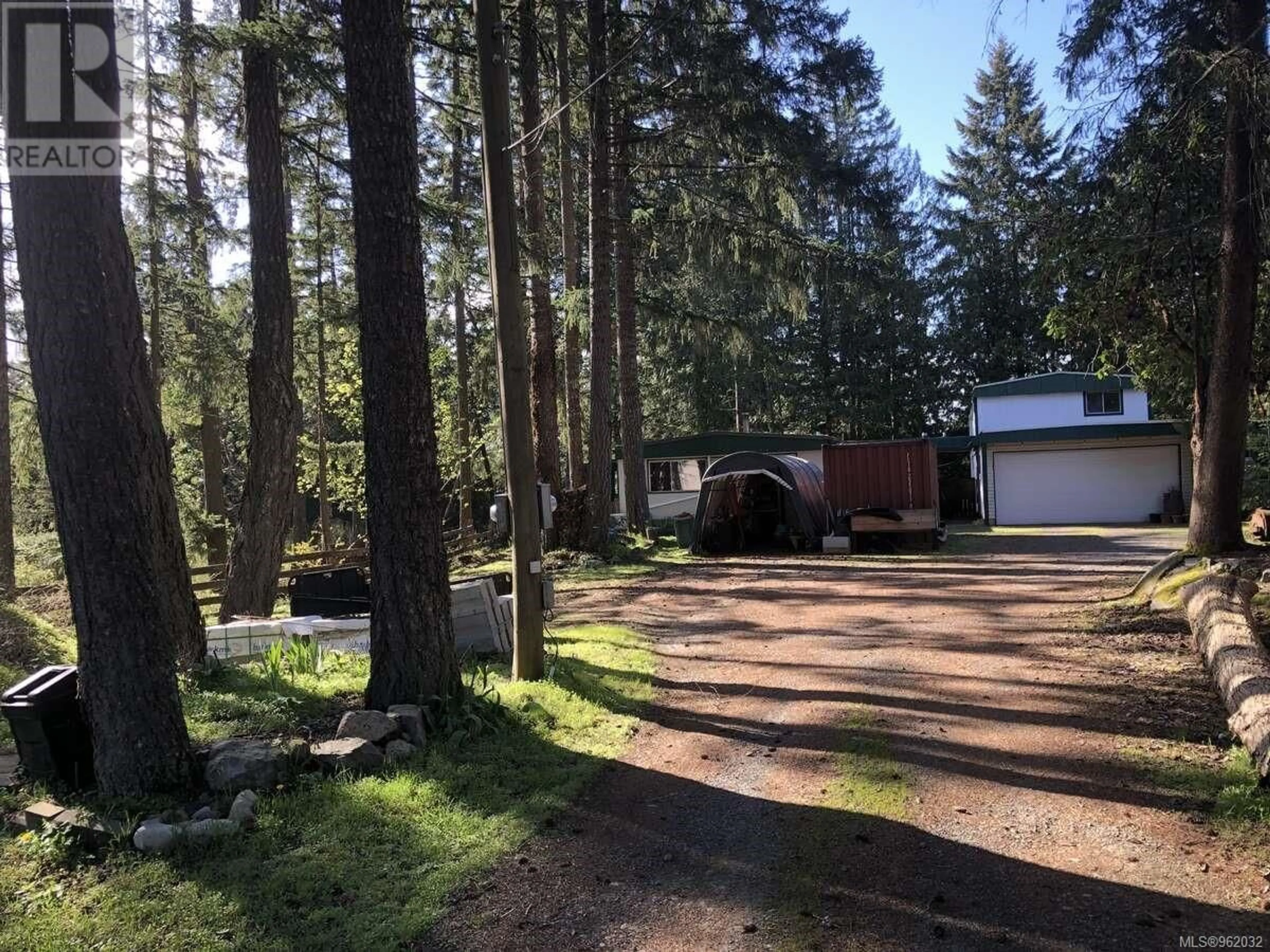 Frontside or backside of a home, the fenced backyard for 69 Lake Pl, Nanaimo British Columbia V9T5S1