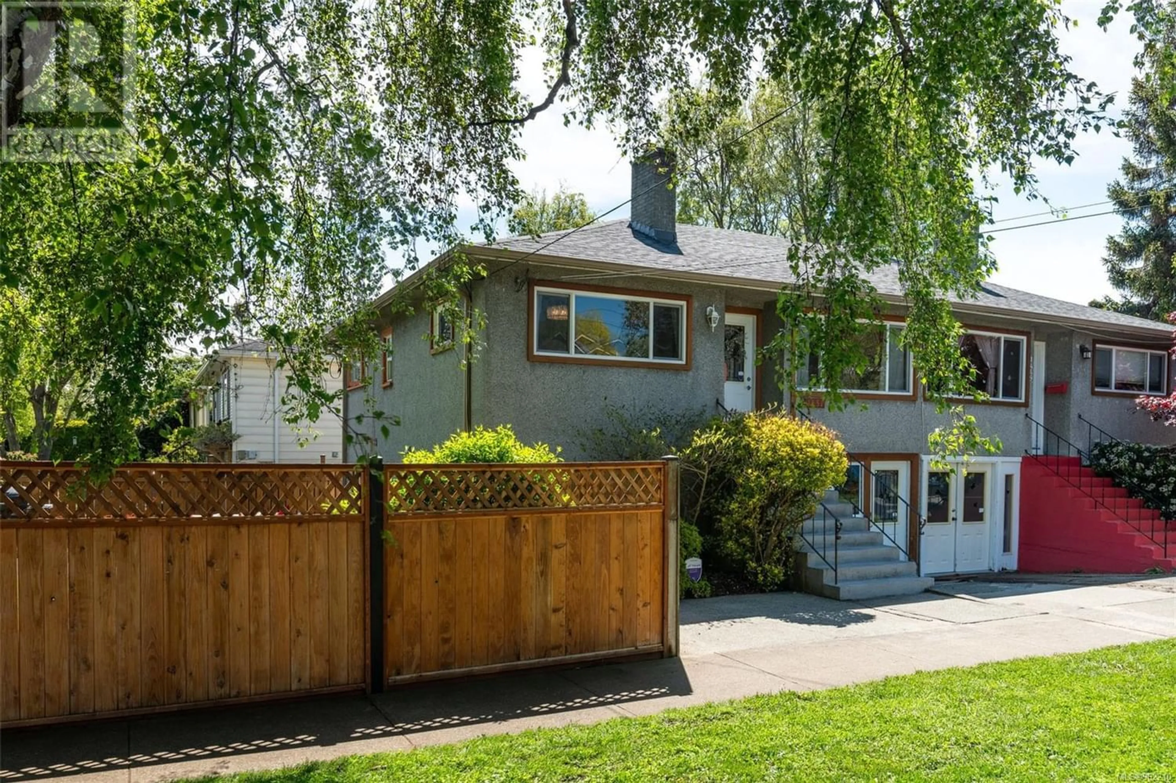 A pic from exterior of the house or condo, the fenced backyard for 1451 Brooke St, Victoria British Columbia V8S1M4