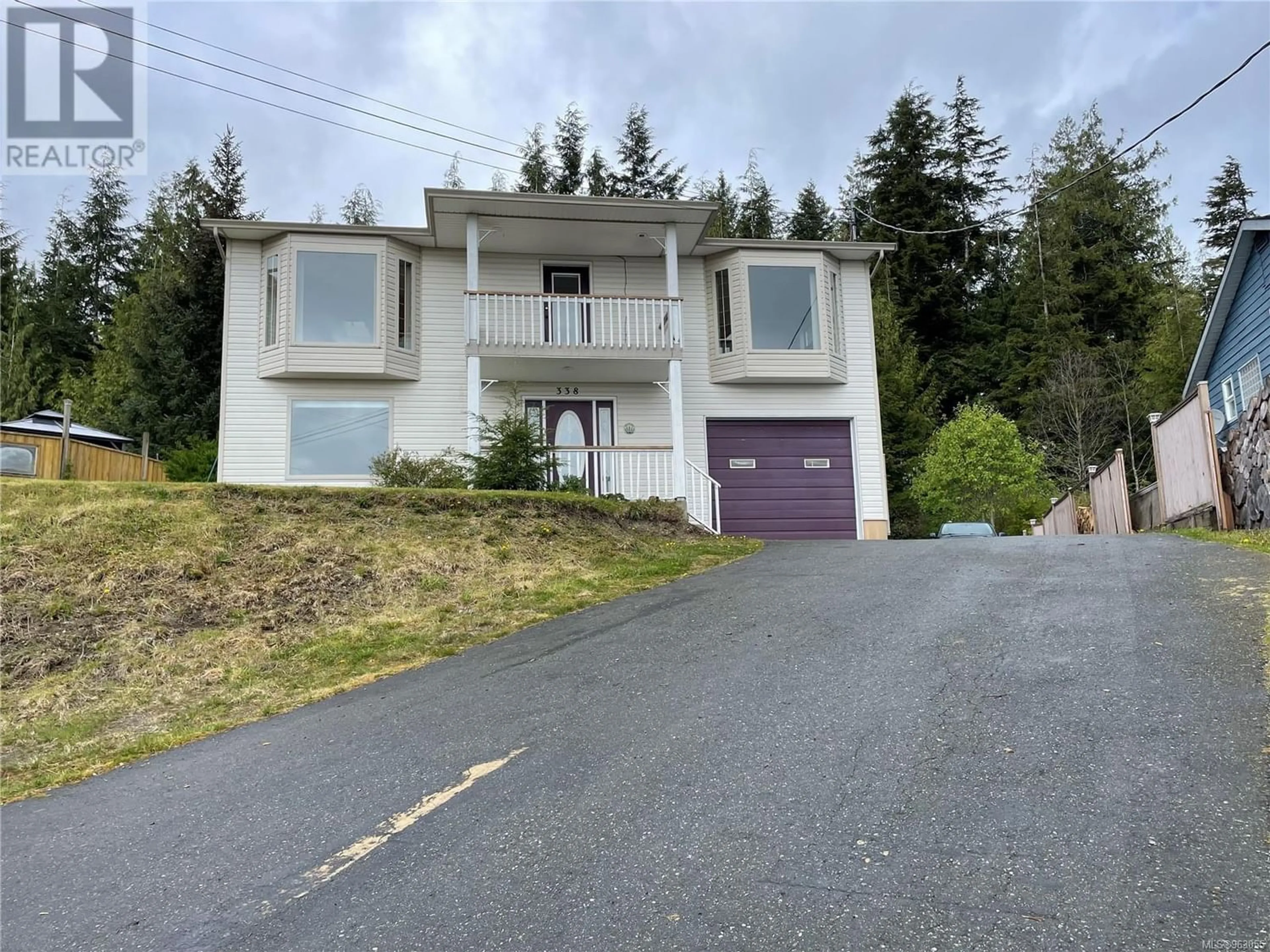 Frontside or backside of a home for 338 Woodland Cres, Port McNeill British Columbia V0N2R0