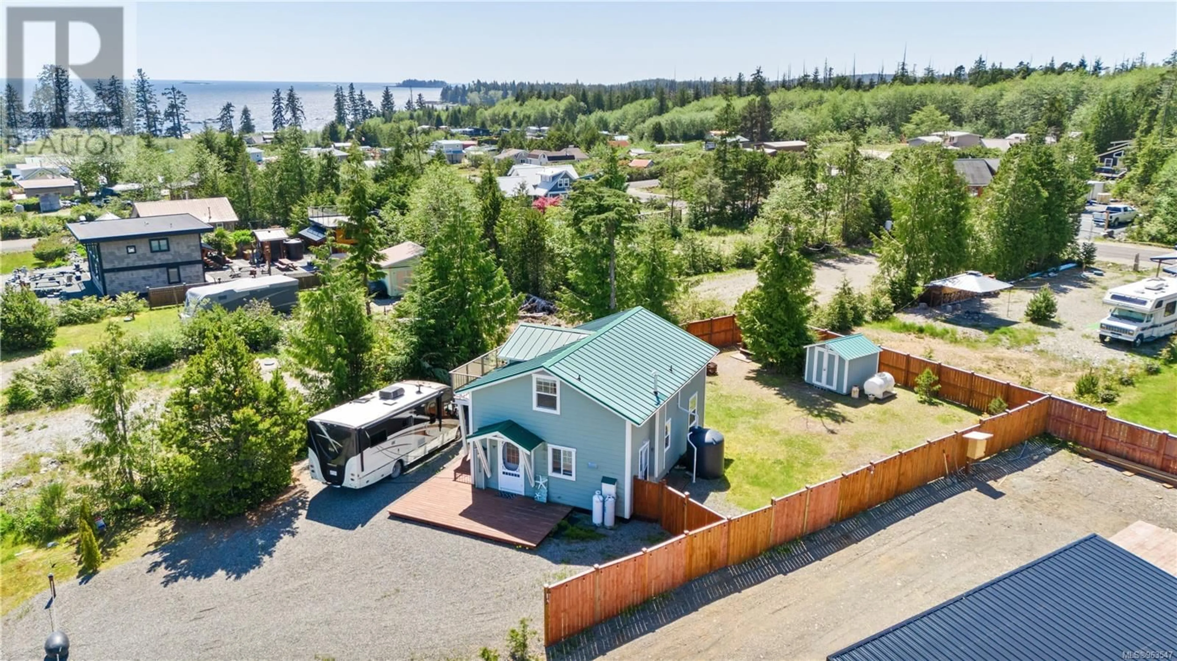 A pic from outside/outdoor area/front of a property/back of a property/a pic from drone, water/lake/river/ocean view for 1129 FIFTH AVENUE, Ucluelet British Columbia V0R3A0