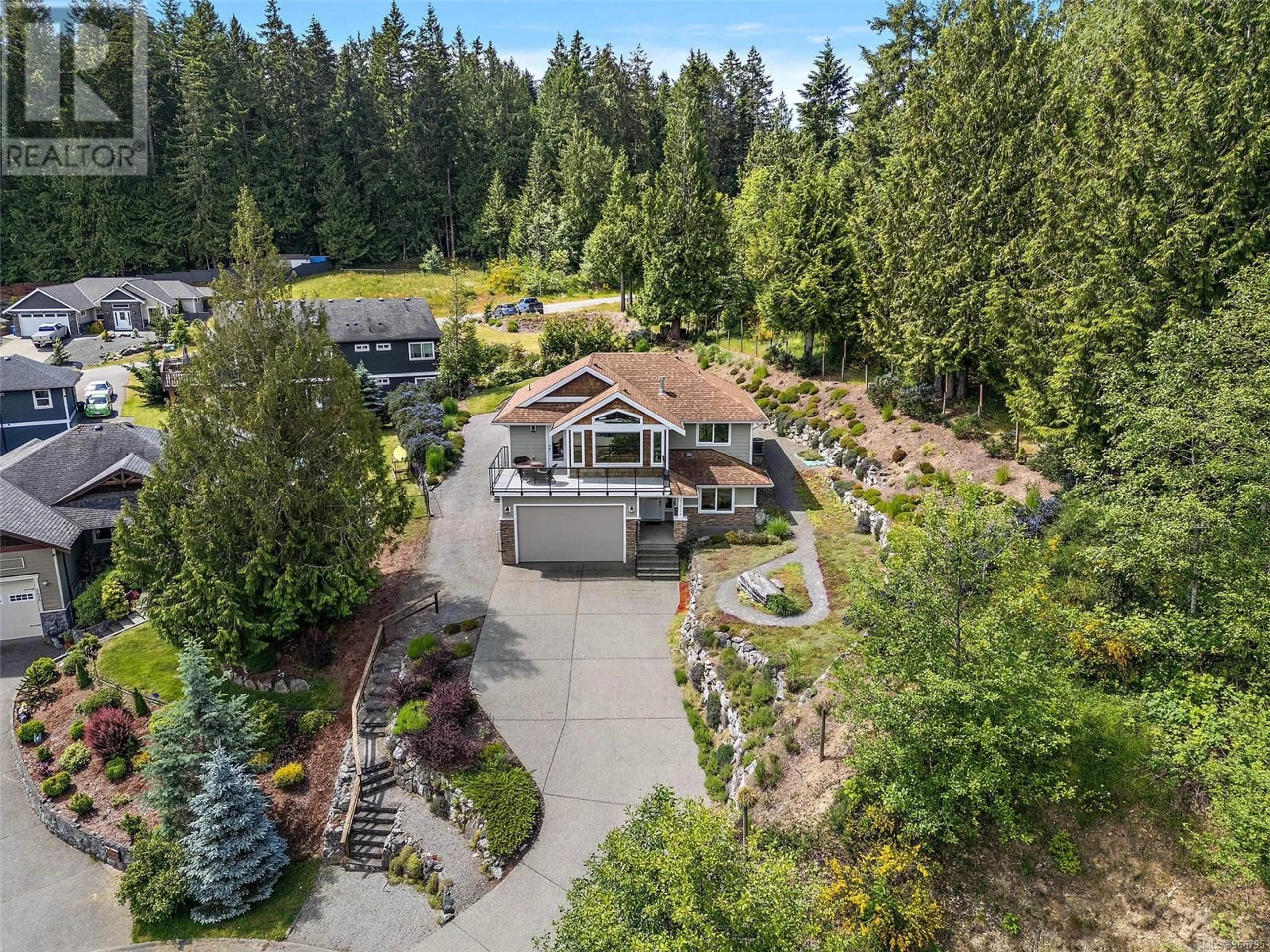 Frontside or backside of a home, the fenced backyard for 2628 Streamside Pl, Mill Bay British Columbia V0R1N2