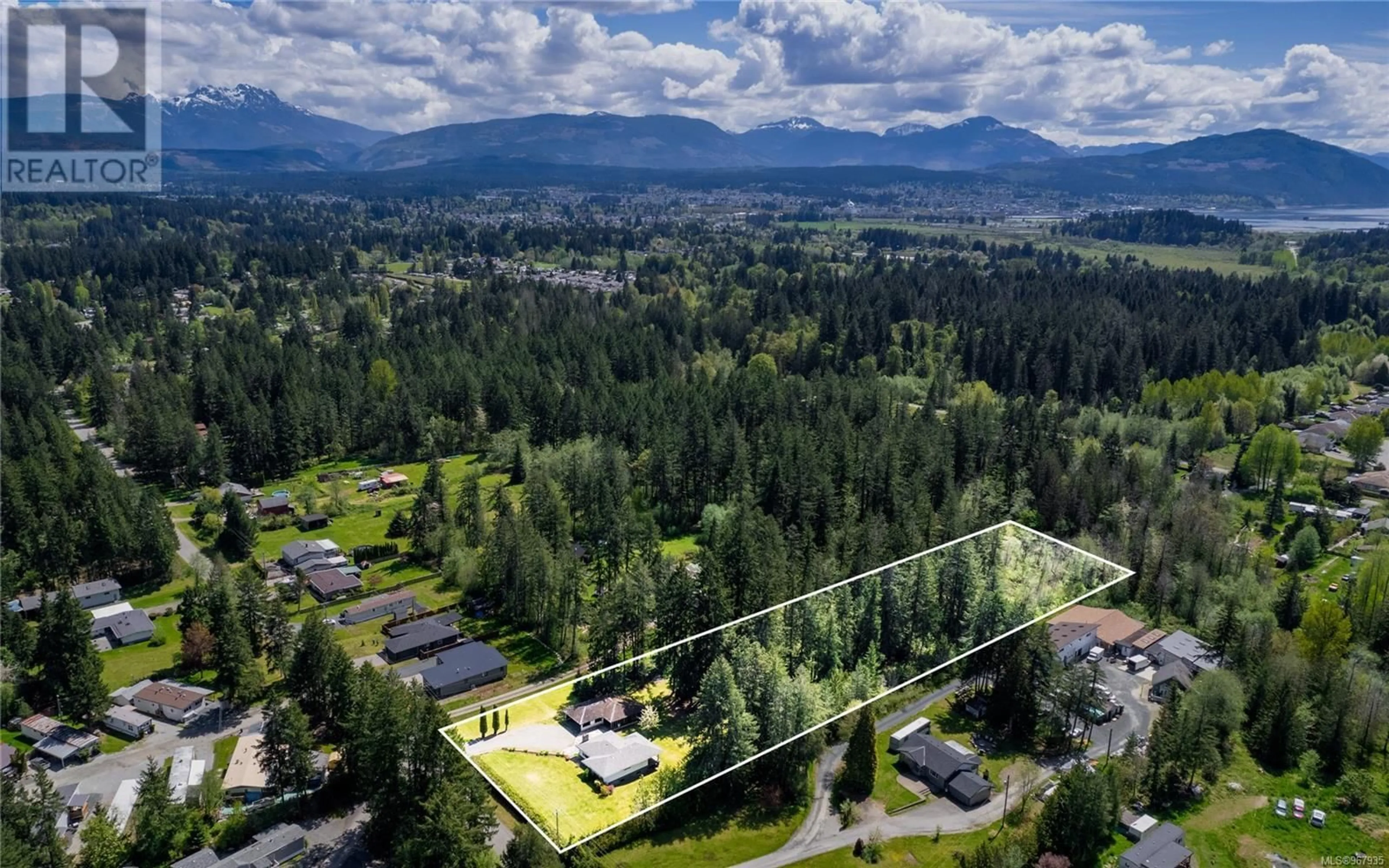 A pic from exterior of the house or condo, the fenced backyard for 6124 Lugrin Rd, Port Alberni British Columbia V9Y8K6